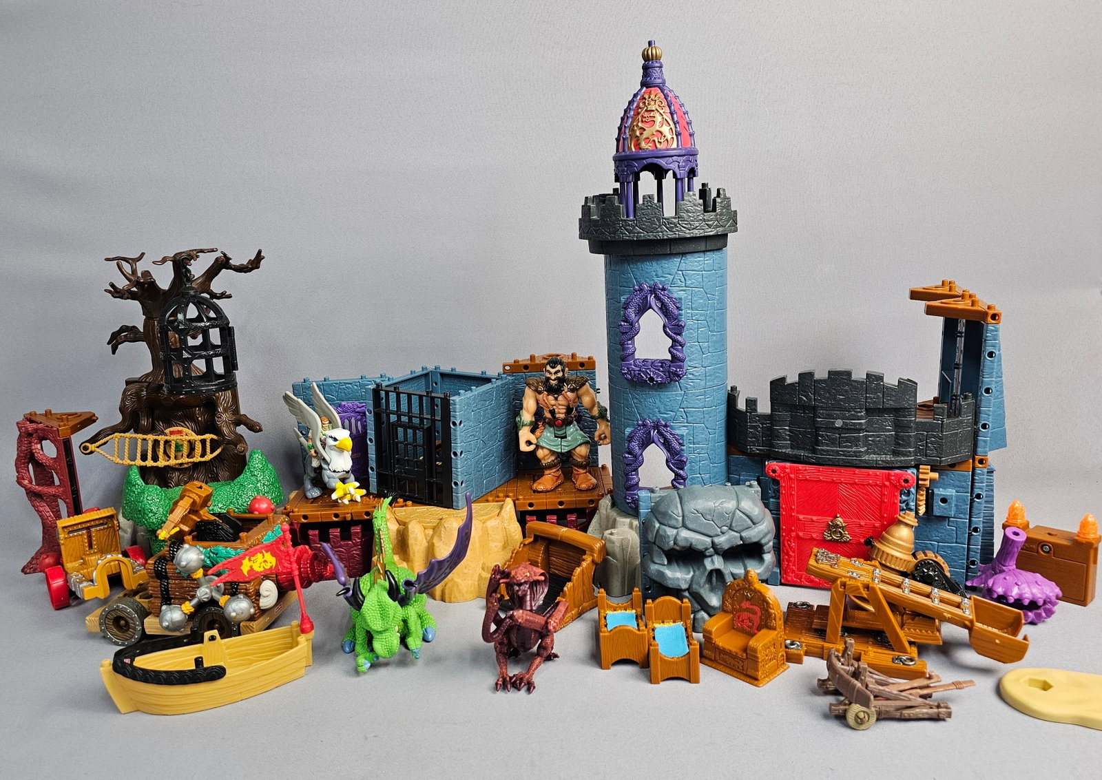 Fisher-Price Imaginext Fantasy Toys and Accessories: This collection primarily consists of components from the Fisher-Price Great Adventures and Imaginext product lines. The assortment includes various structural elements such as a large blue castle tow