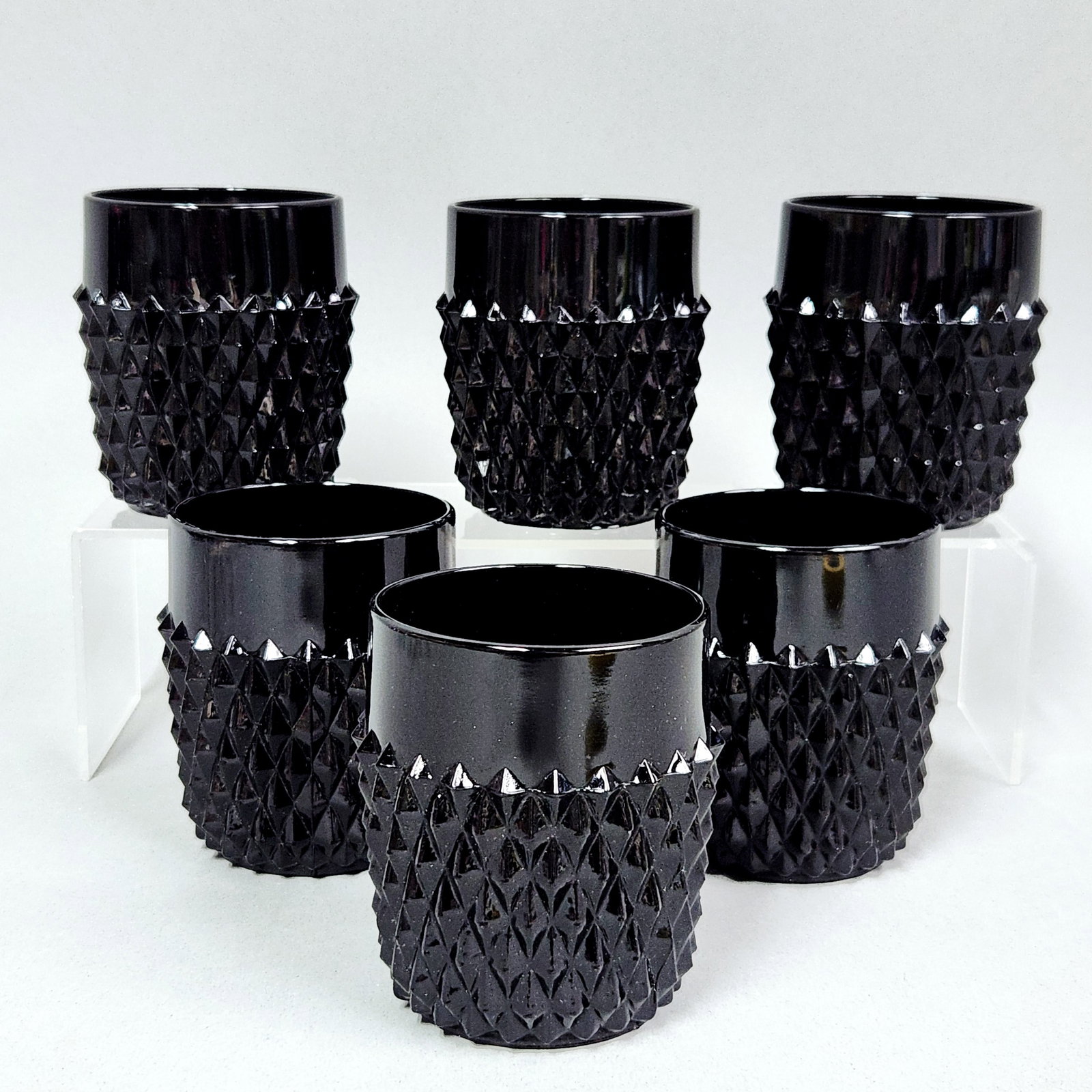 Tiara Diamond Point Black Tumblers: This set of juice tumblers is attributed to the Indiana Glass Company in the Tiara Diamond Point pattern, sometimes referred to as the Cameo pattern. Height: 2.5 inches Diameter: 2.25 inches. The tumb