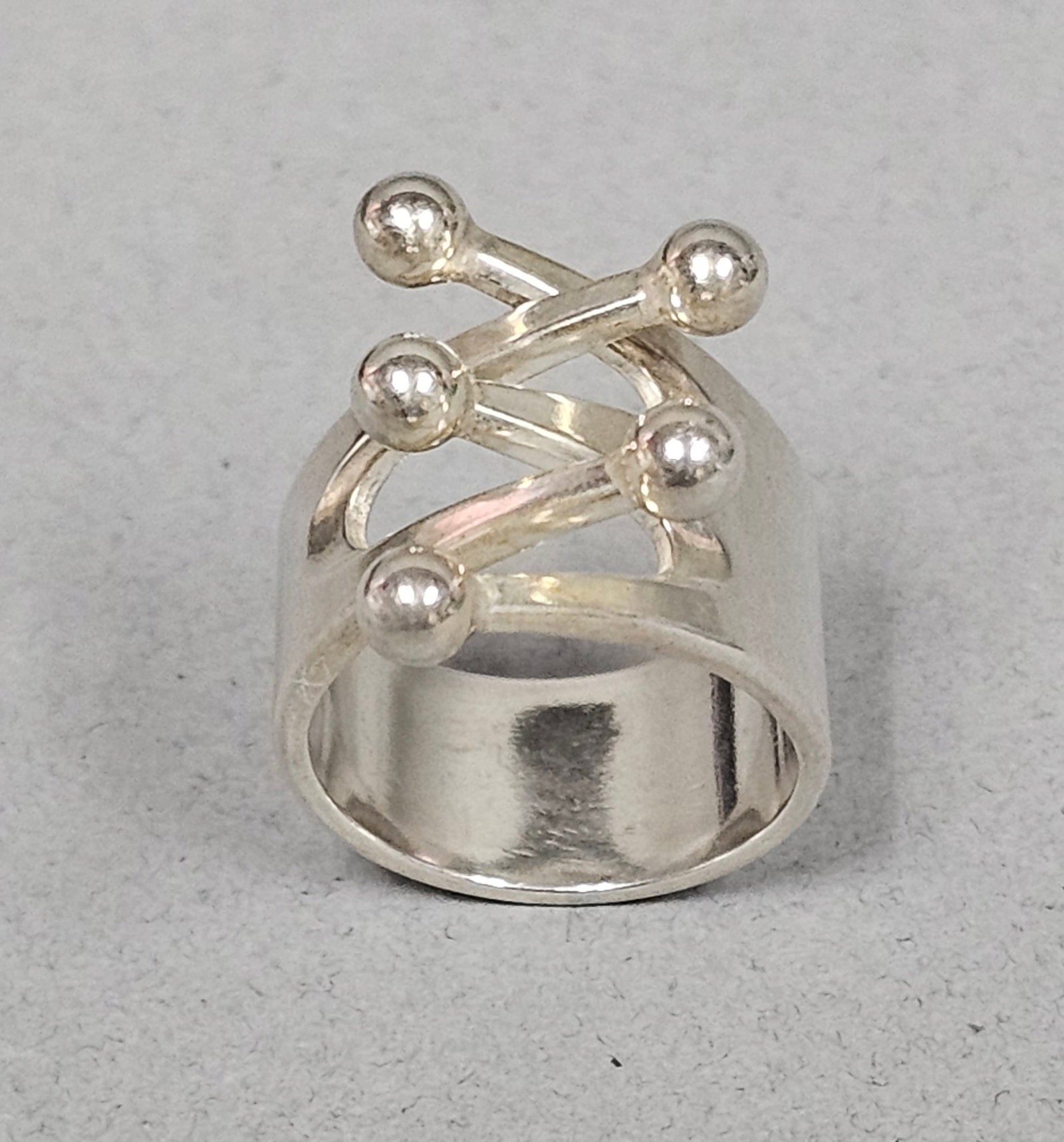 Anna-Greta Eker Sterling Silver Ring 9.3 Grams: A Norwegian modernist sterling silver statement ring designed by Anna-Greta Eker for the Plus applied arts center in Fredrikstad. The interior of the band is stamped with the designer hallmark AGE, th