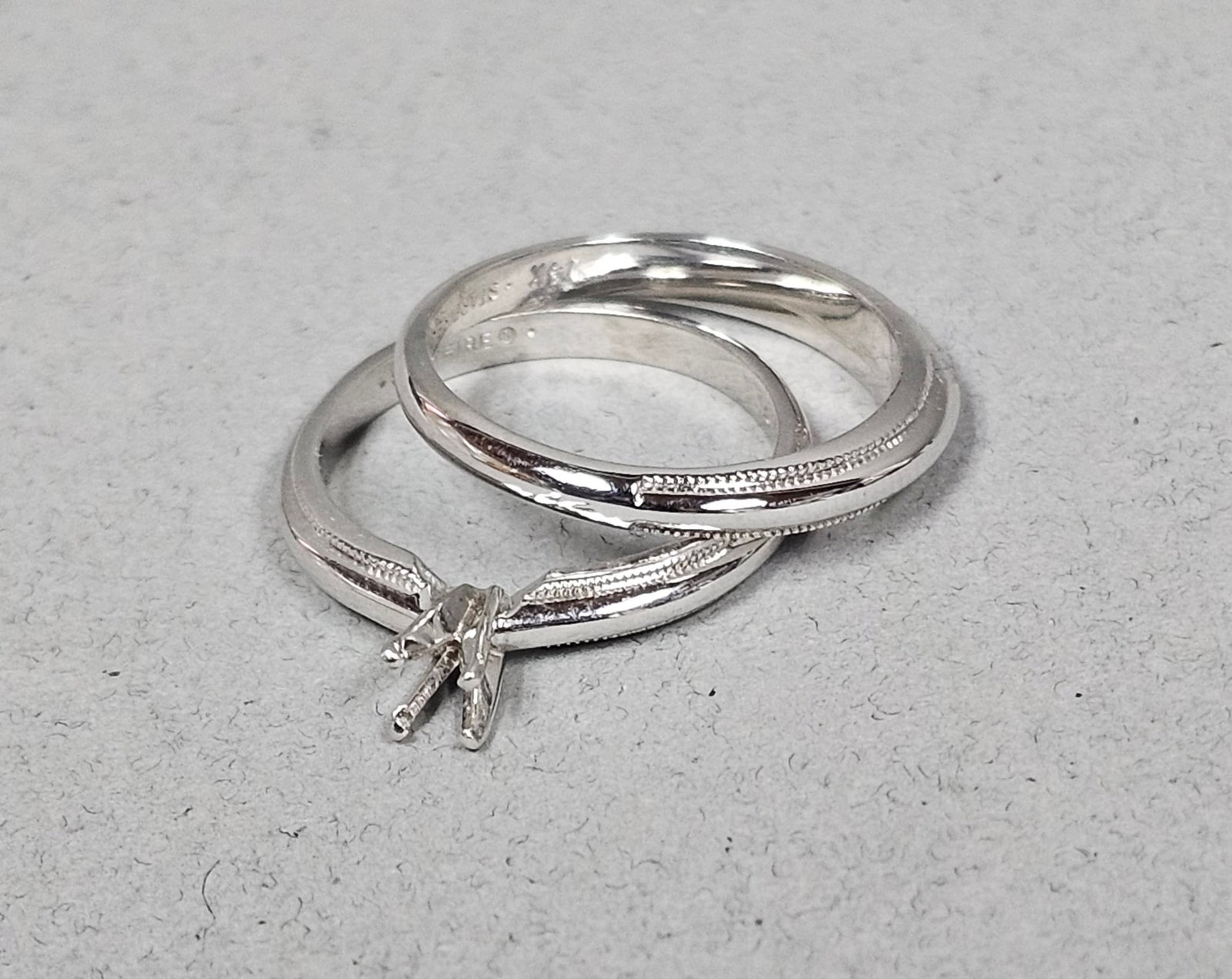 Starfire 14K Engagement Ring Semi-Mount & Band 4.8 Grams: A matching wedding set by Starfire crafted in 14 karat white gold. The set consists of a solitaire engagement ring semi-mount and a coordinating wedding band. The engagement ring features a four-prong