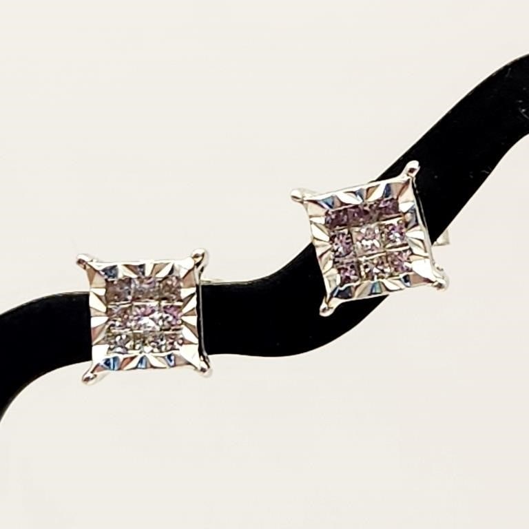 10K Gold Square Cluster Stud Earrings 1.3 Grams: This pair of stud earrings is crafted in 10 karat white gold. Each earring features a square-shaped head set with a cluster of small round colorless stones that appear to be diamonds. Earring backs ar