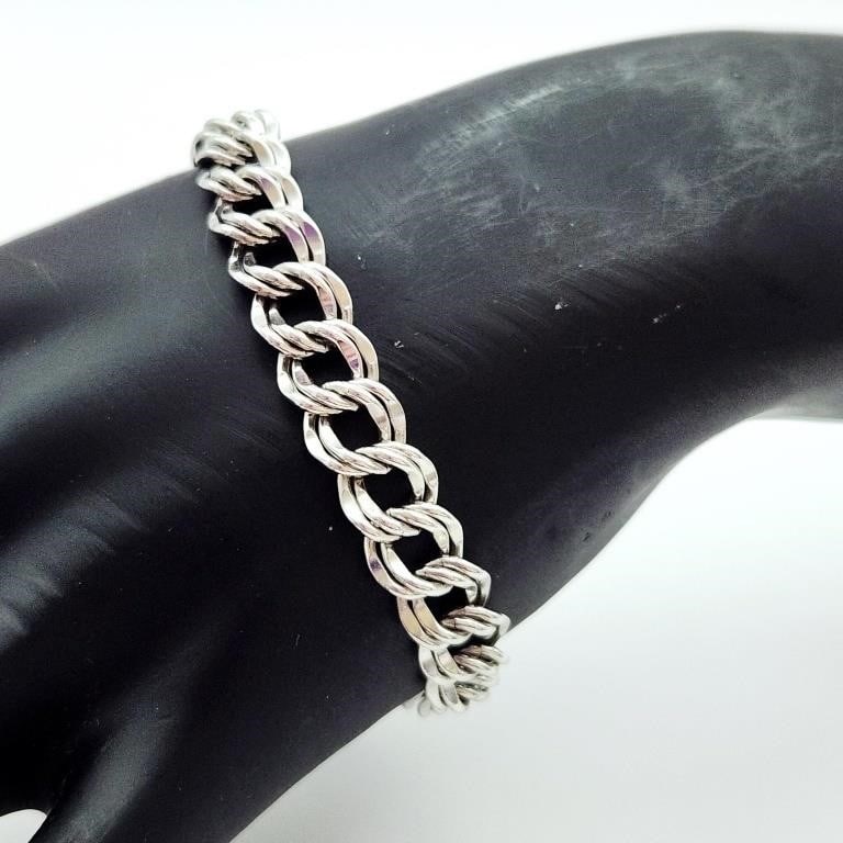 Beaucraft Beau Sterling Bracelet 21.3 Grams: A Beaucraft sterling silver bracelet featuring a double curb link construction. The underside of the clasp is stamped with a circular hallmark reading BEAU B STERLING, identifying the manufacturer as 