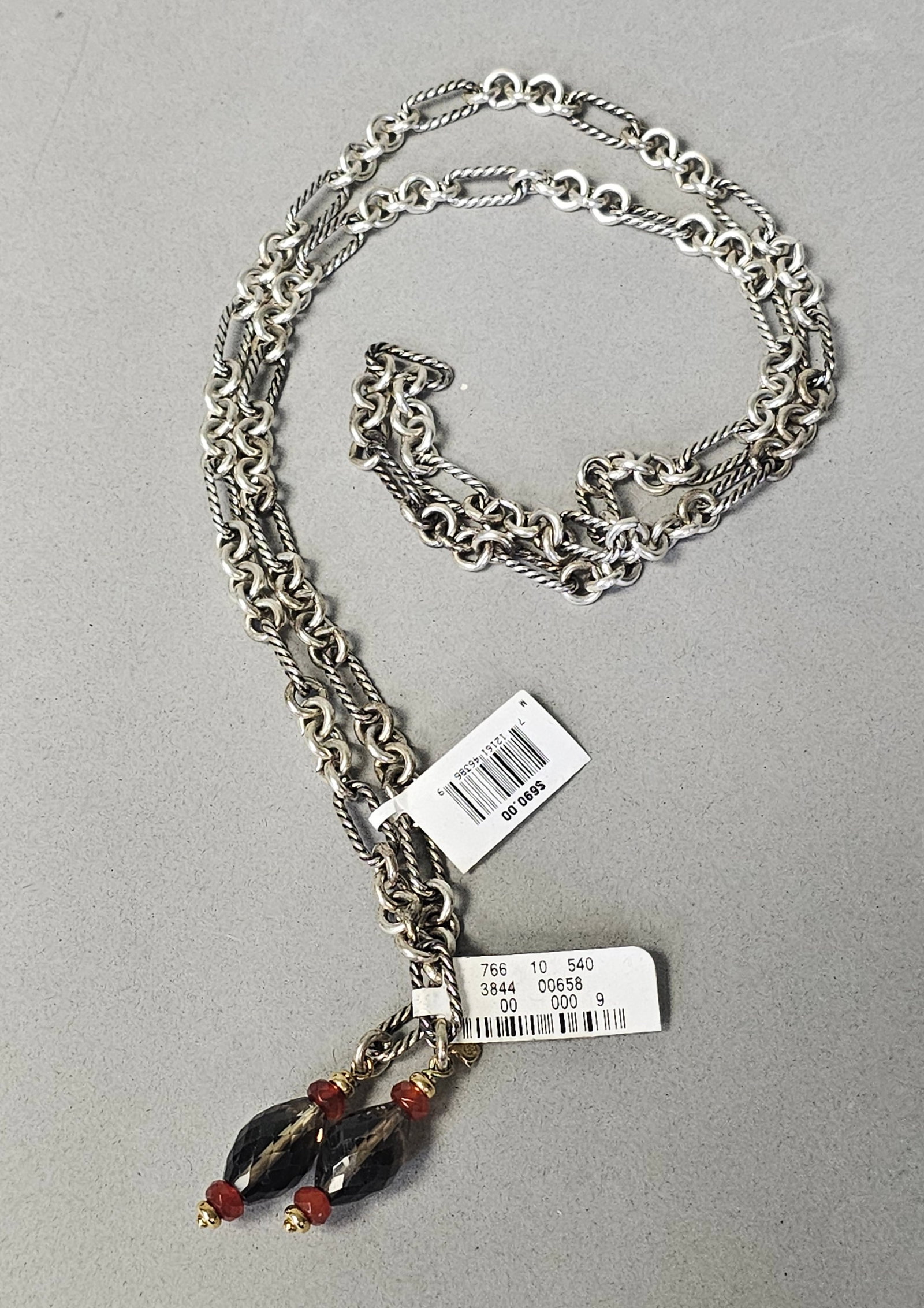 David Yurman Sterling & 18K Gold Bijoux Necklace 92.6 Grams: A David Yurman lariat-style necklace from the Bijoux collection featuring smoky quartz and carnelian accents. The piece is constructed with a mixed link chain composed of sterling silver cable-twisted