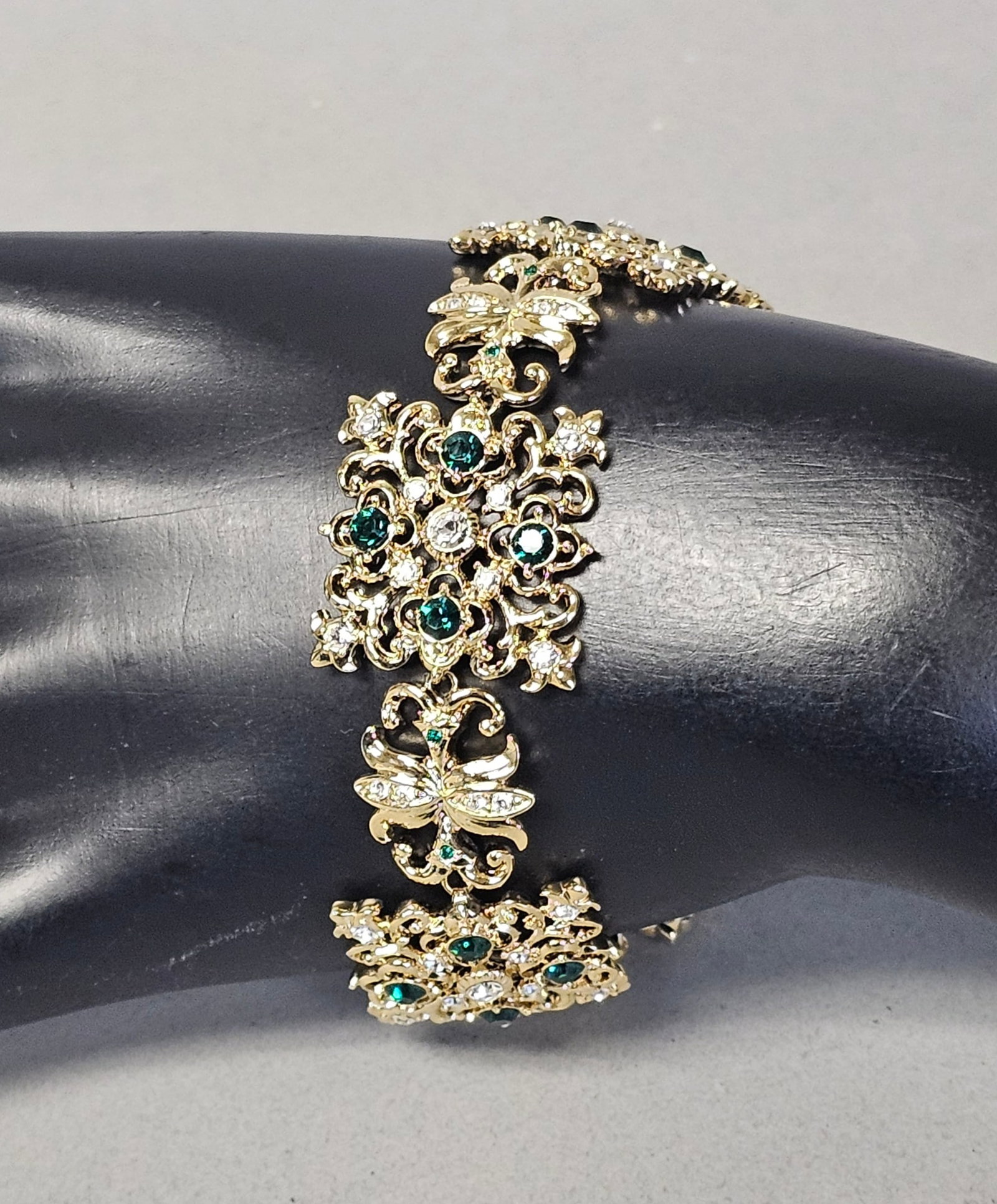 Camrose & Kross JBK Jacqueline Kennedy Bracelet: This gold-tone link bracelet is a reproduction piece from the Jacqueline Bouvier Kennedy (JBK) Collection by Camrose and Kross. The design features four large, rectangular openwork filigree panels