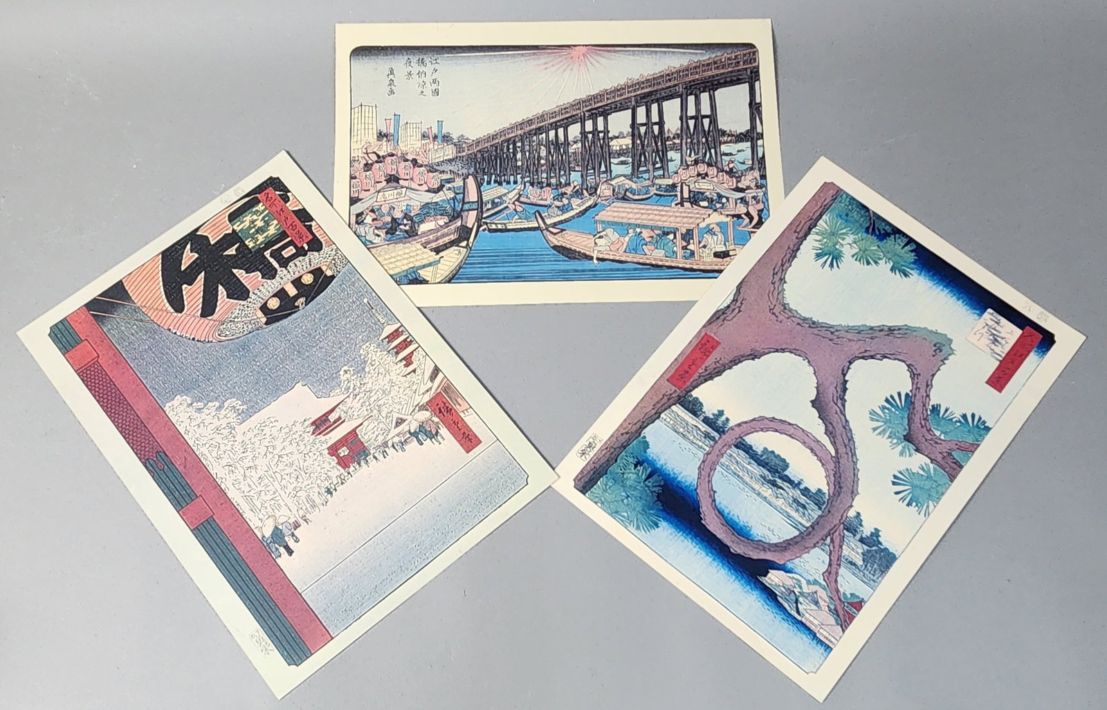 Trio of Japanese Woodblock Prints: This is a group of three nishiki-e (multi-colored) woodblock prints featuring celebrated designs by Utagawa Hiroshige (1797-1858). These examples are high-quality 20th-century editions produced from r