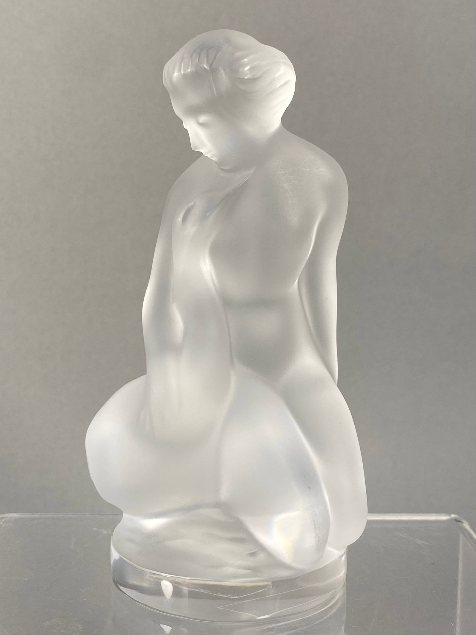 Lalique France Frosted Crystal Leda Figurine: This Lalique frosted crystal figurine, titled Leda and the Swan (Leda et le Cygne), is model number 11905. The sculpture depicts a stylized kneeling female nude in a graceful, bowed pose beside a swan