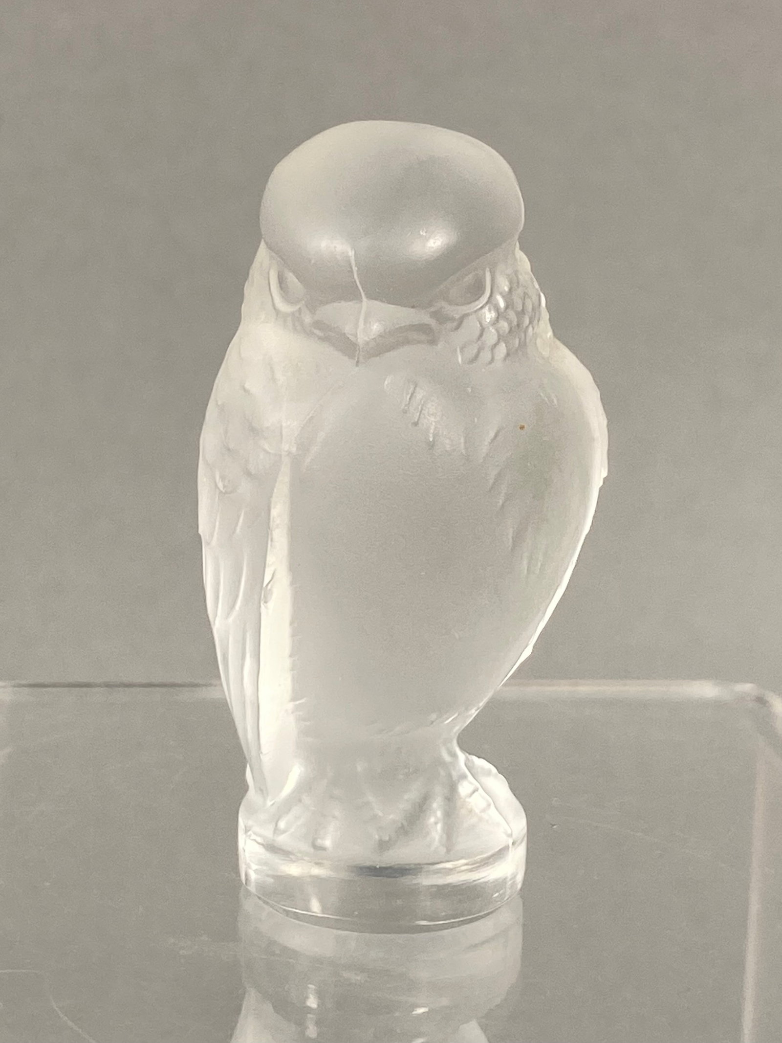 Lalique France Crystal Rapace Owl Figurine: A frosted and clear lead glass figurine of an owl, identified as the Rapace model (also known as the Little Owl) produced by the French glassmaker Lalique. The figurine is depicted in a static,