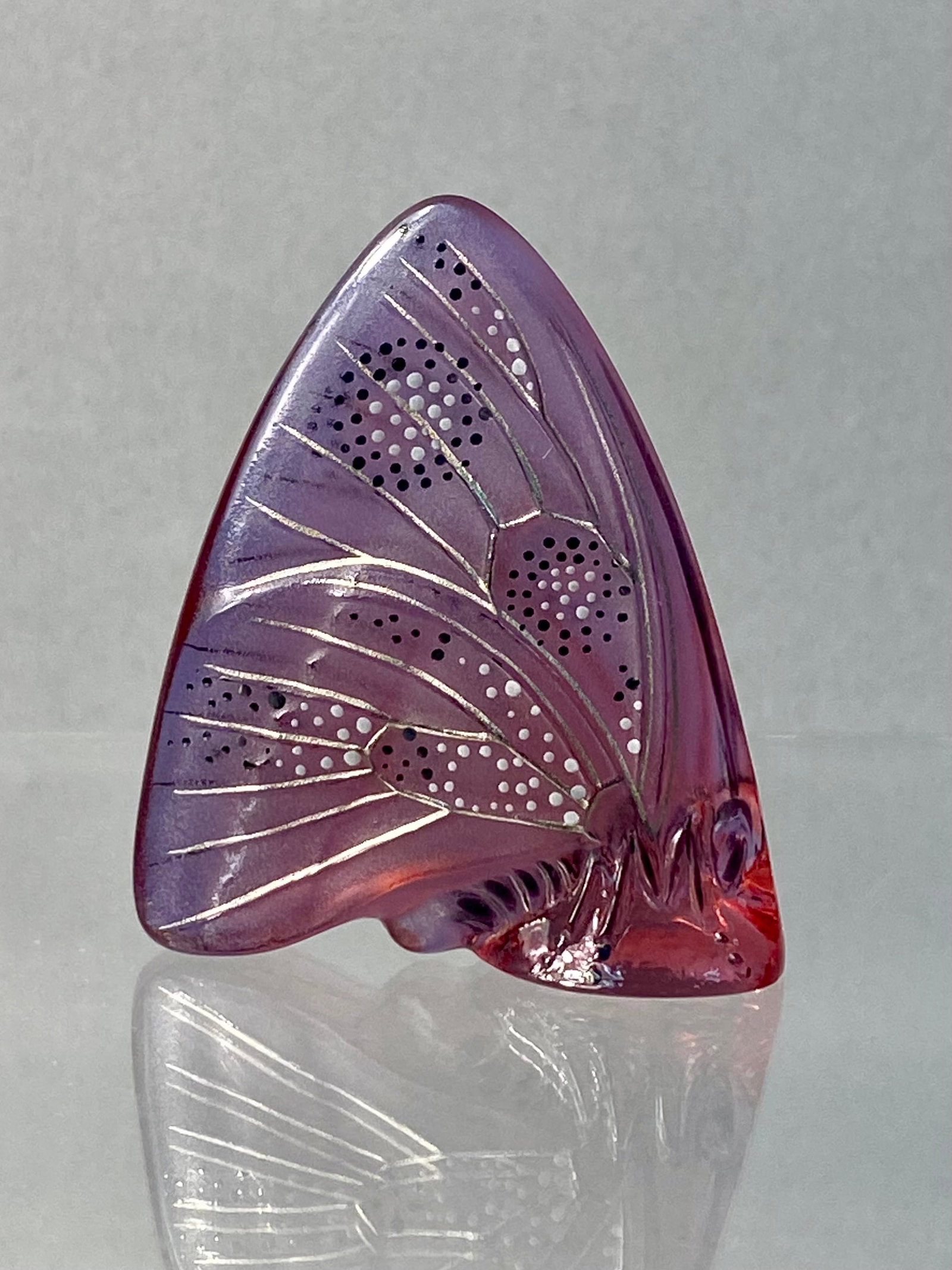 Lalique France Grand Nacre Glass Butterfly Wing Figurine: A molded glass figurine by Lalique France in the Grand Nacre butterfly pattern. The piece is designed as a single stylized butterfly wing standing upright on an integrated base. The glass displays a