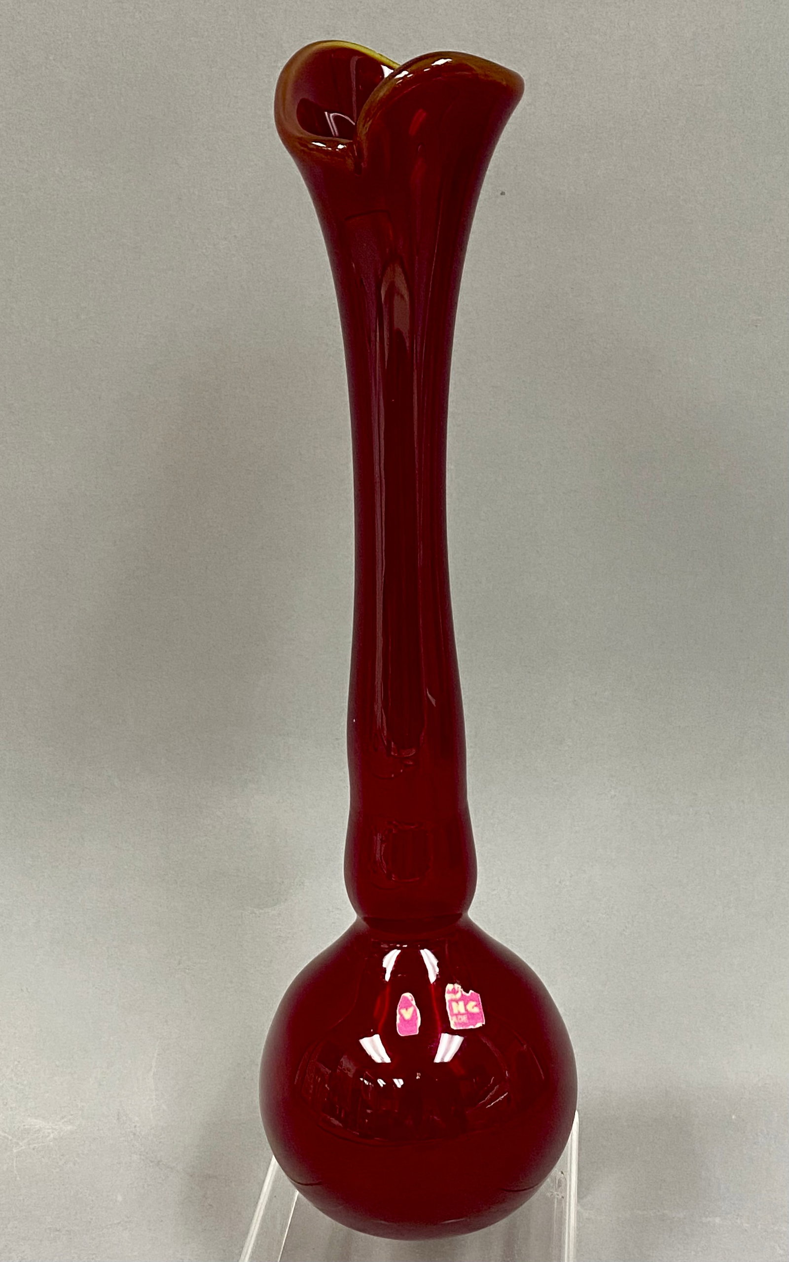 Viking Art Glass Ruby Red Vase: This mid-century modern art glass vase, identification number 7276, was produced by the Viking Glass Company of New Martinsville, West Virginia. Rendered in a vibrant ruby red, the piece features a bu