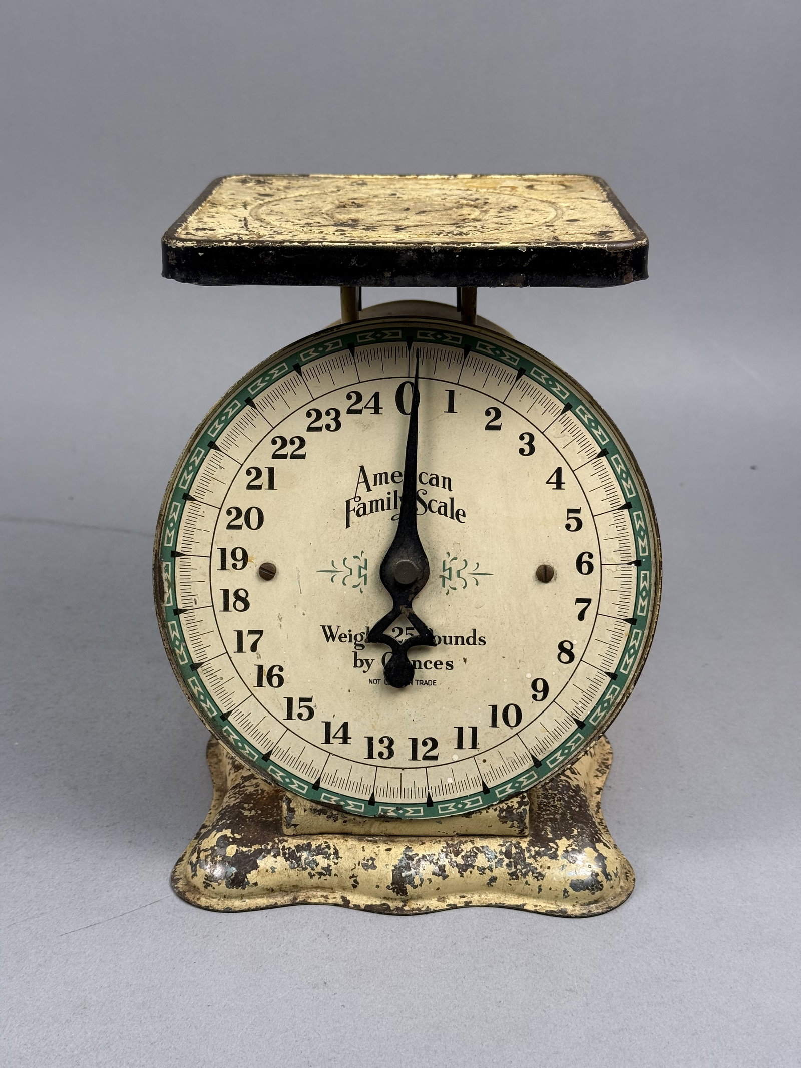 American Family 25 Pound Mechanical Kitchen Scale: This antique mechanical kitchen scale is manufactured by the American Family Scale company. A partially preserved decal on the side of the housing depicts a globe and includes the text SCALES MADE IN