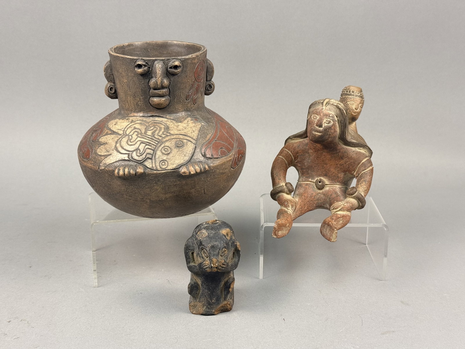 Studio Ceramics Inc an Ernesto Duran Vessel: This lot contains three ceramic items created in the styles of various indigenous South American and West Mexican cultures. The first item is a contemporary polychrome studio ceramic vessel by the