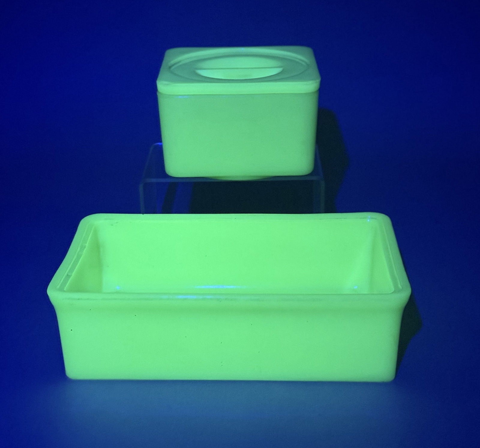Vintage Jadeite Uranium Glass Refrigerator Dishes: This trio of vintage refrigerator storage containers is crafted from opaque jadeite green glass, categorized as uranium glass for its distinct vibrant green fluorescence under ultraviolet light.