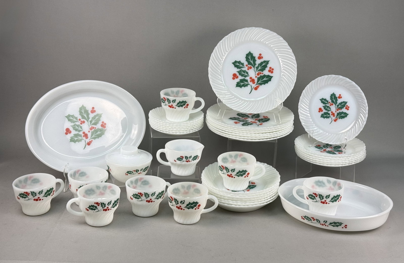 Termocrisa Mexico Glass Holly Berry Dinnerware: This collection of vintage heat-resistant dinnerware was manufactured by Termocrisa in Mexico. The pieces are constructed from opaque white milk glass and feature a festive polychrome