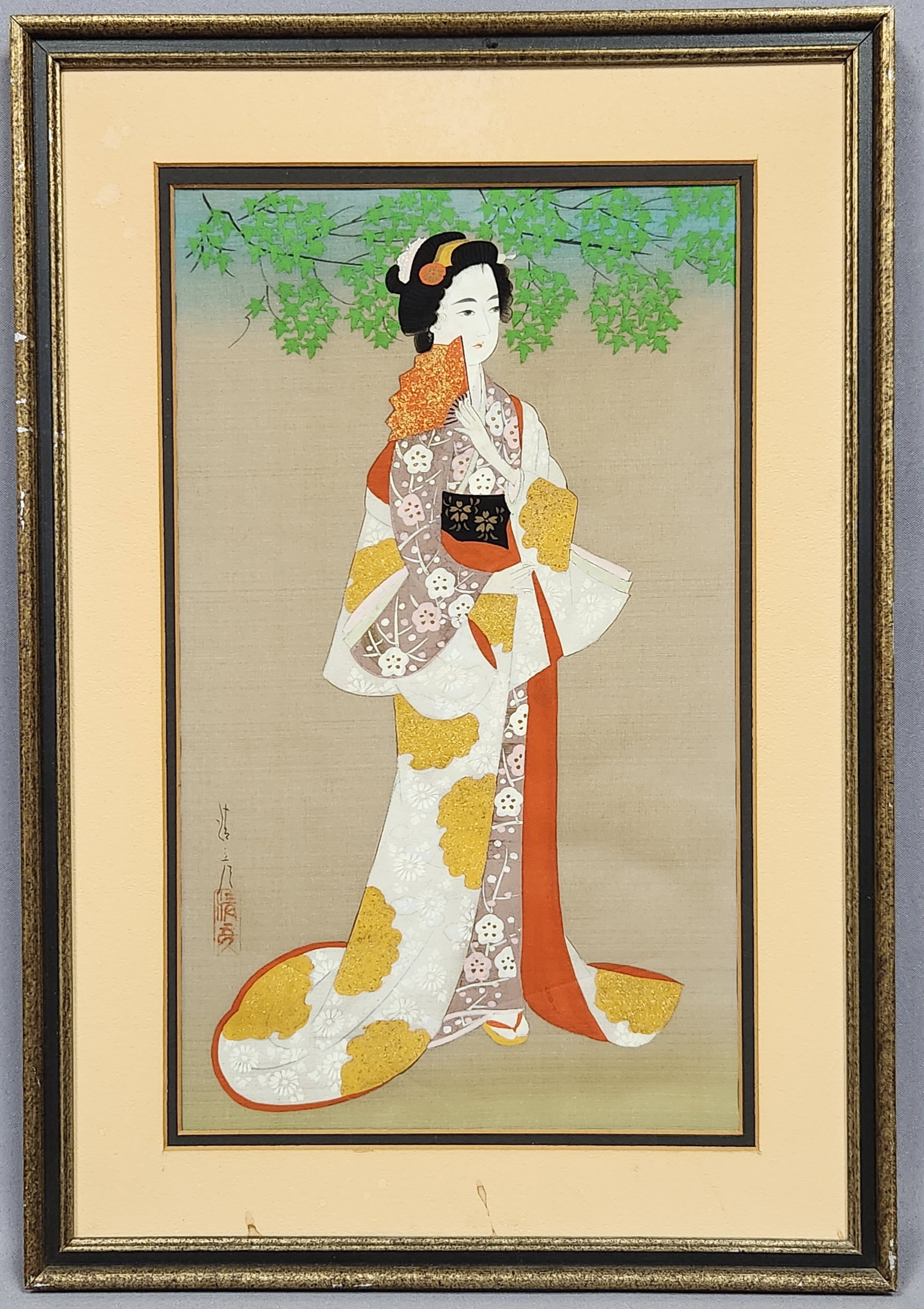 Japanese Oshi-e Mixed-Media Textile Artwork: A framed Japanese mixed-media textile artwork utilizing the oshi-e technique of padded fabric collage. The composition depicts a standing bijin (beautiful woman) wearing a layered kimono with floral p