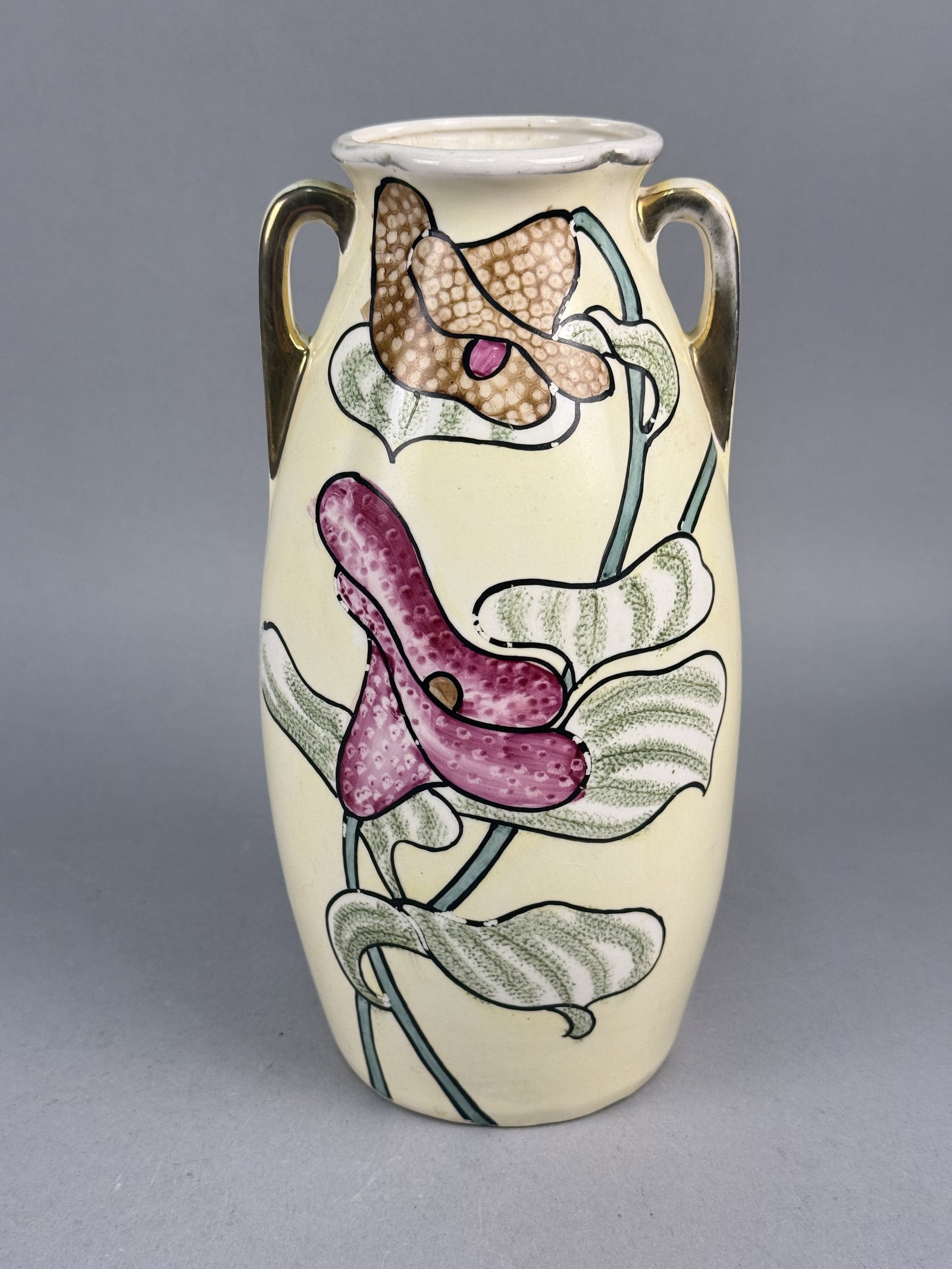 Royal Nishiki Nippon Art Nouveau Ceramic Vase: A double-handled ceramic vase of tapered ovoid form by Royal Nishiki Nippon, featuring a flared and scalloped rim. The underside of the base bears a circular ink stamp featuring the words ROYAL and NI