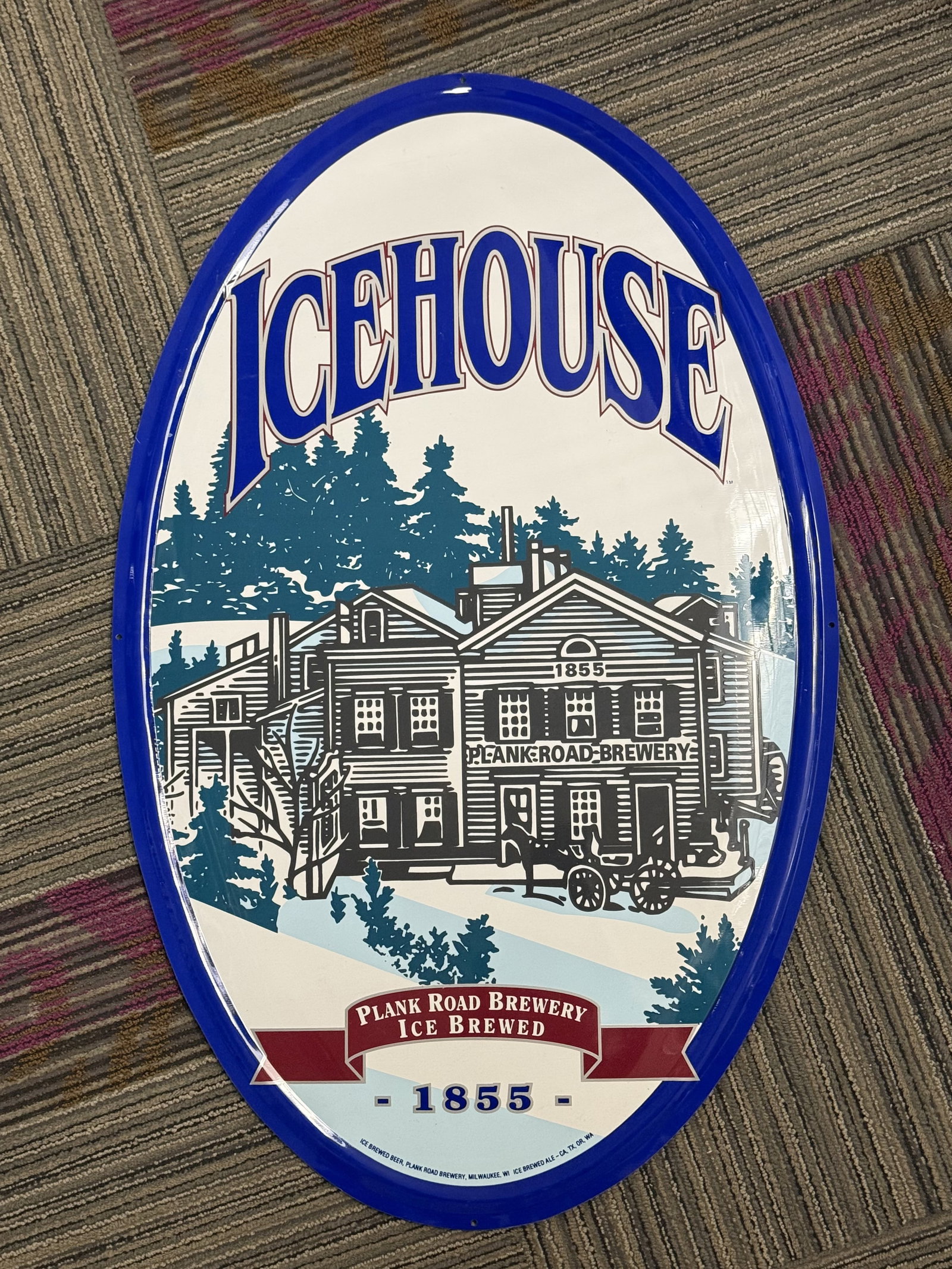 Icehouse Brewery Oval Metal Bar Sign: Large oval advertising sign for Icehouse beer, a brand produced by Plank Road Brewery, a division of Miller Brewing Company. The sign is made of lithographed metal with a high-gloss finish. Fine print