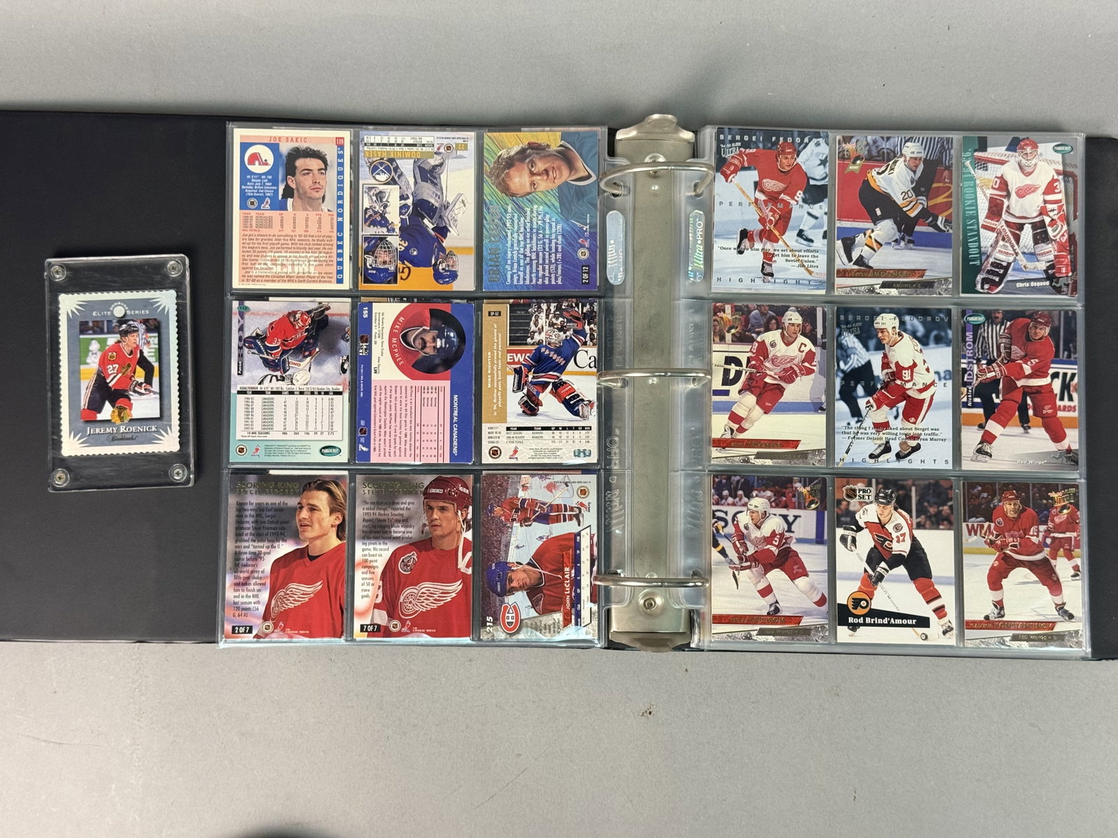 NHL Hockey Trading Card Collection: This collection of National Hockey League (NHL) trading cards primarily dates from the late 1980s through the mid-1990s. The lot includes a highlight item: a 1993 Donruss Elite Series Jeremy Roenick c
