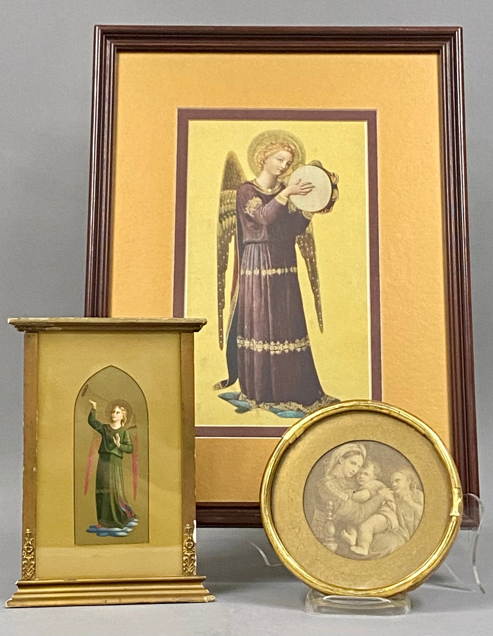 3 Religious Prints in Decorative Frames: This group consists of three framed religious prints featuring motifs from the Italian Renaissance. The largest work is a color print of an angel playing a tambourine, after a fresco by Fra Angelico.