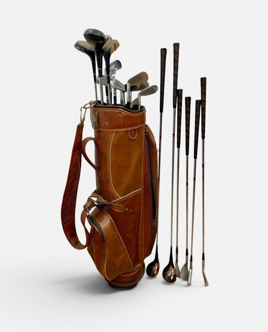 Vintage Walter Hagen & Wilson Patty Berg Golf Clubs: This collection of vintage golf equipment is centered around a 14-piece Walter Hagen set. The Hagen set comprises woods numbered 1, 2, 3, and 4 with persimmon-style heads and decorated sole plates,