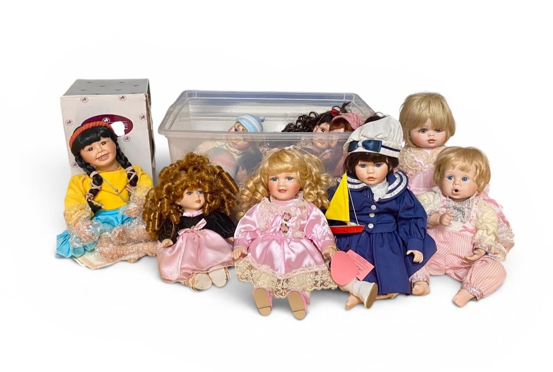 10 Collectible Porcelain Dolls: This collection includes multiple collectible dolls featuring bisque porcelain heads, hands, and feet with soft stuffed cloth bodies. Key items include the Little Flower doll from The Ashton-Drake Gal