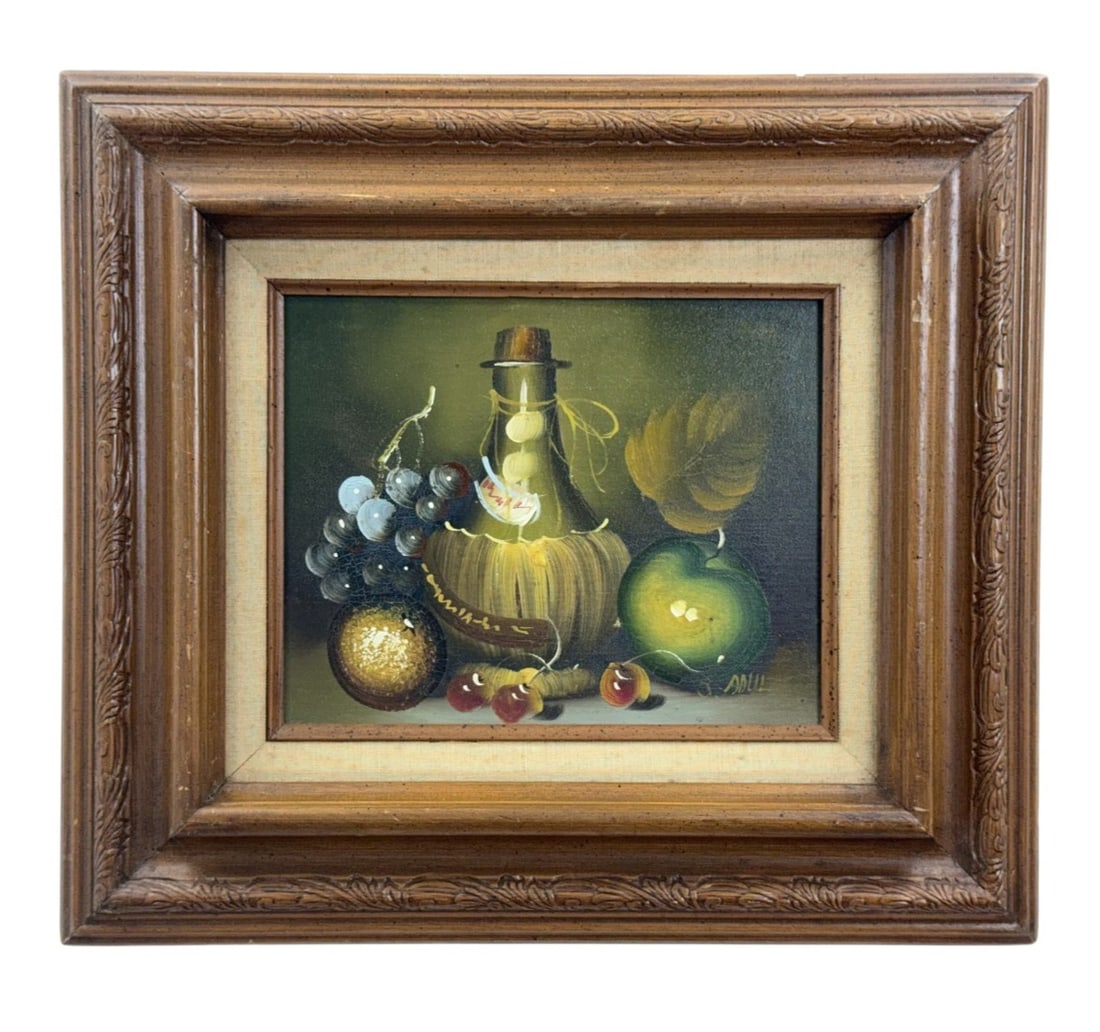 J. Adul, Mid-20th Century Still Life Oil on Canvas: This mid-20th-century decorative still life painting is an oil on stretched canvas depicting a traditional arrangement of a straw-wrapped Chianti bottle, a cluster of blue-black grapes, a green