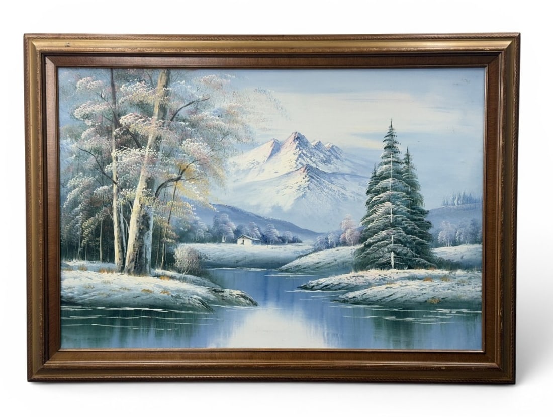 20th Century Winter Mountain Oil on Canvas: This 20th-century winter landscape is an oil on canvas painting executed in a decorative studio style. No signature is visible on the front or reverse of the work. The painting is housed in a wide, gi