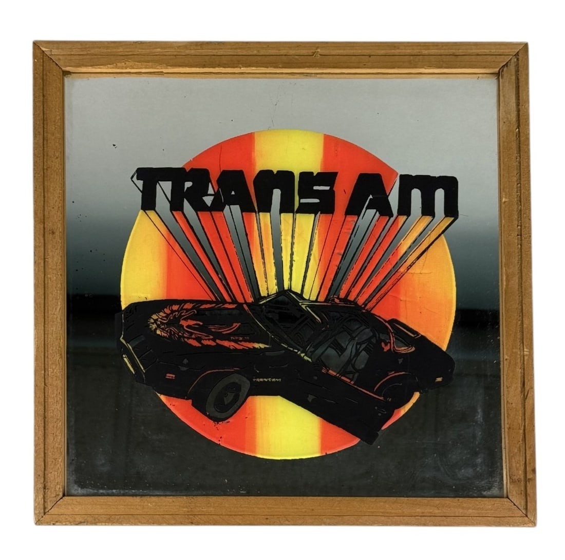 Vintage Pontiac Trans Am Carnival Mirror: This vintage silkscreened mirror features a black second-generation Pontiac Trans Am set against a stylized yellow and orange sunburst. The graphic includes the iconic "Screaming Chicken" hood decal