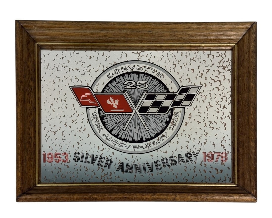 Chevrolet Corvette Silver Anniversary Mirror: This commemorative wall mirror celebrates the silver anniversary of the Chevrolet Corvette, featuring screen-printed graphics across an antiqued glass surface. The design incorporates the official cro