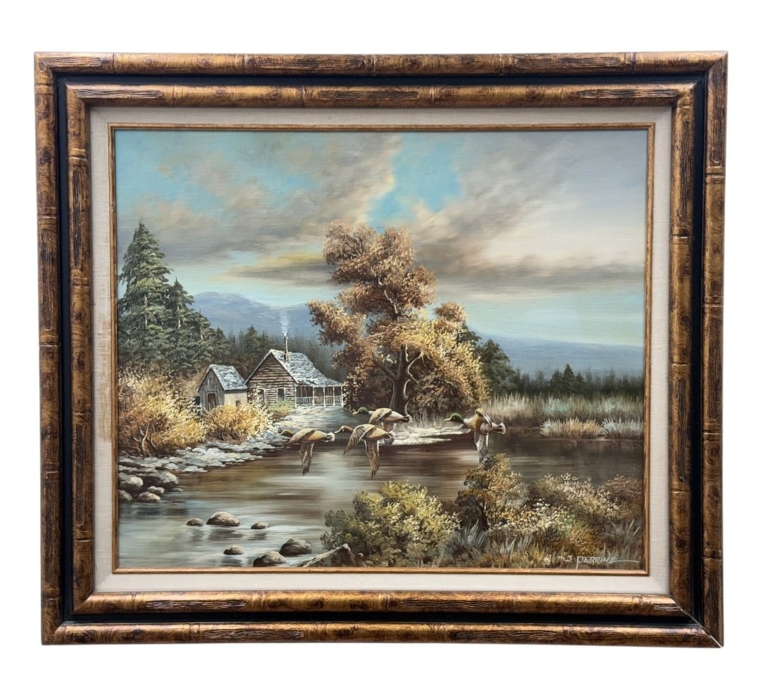 J. Perrine Oil Landscape with Ducks: This original oil on canvas by J. Perrine depicts an autumnal riverside landscape with mallard ducks in flight and rustic log cabins. The work is executed in a representational style with textured bru
