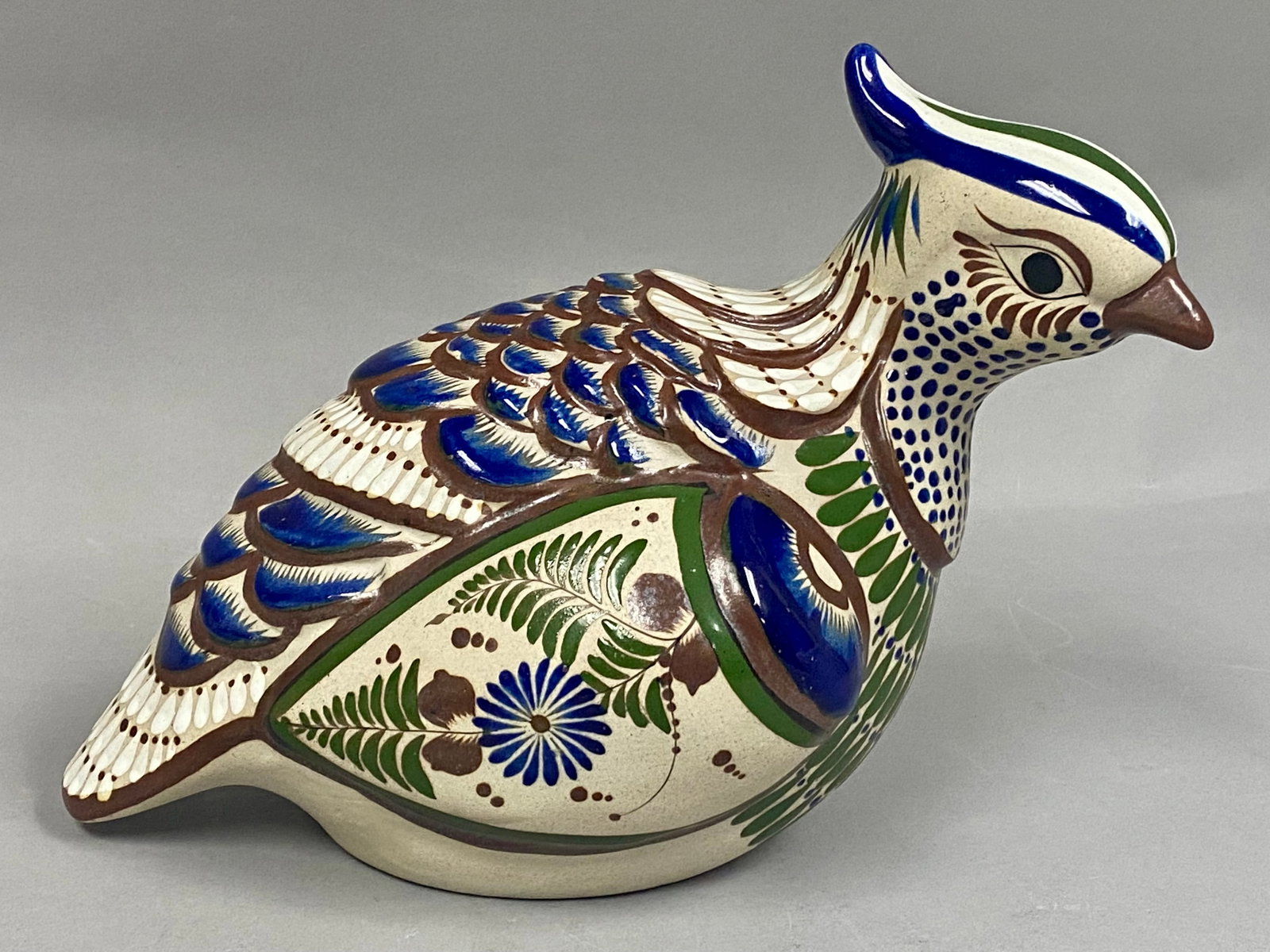 Tonala Mateos Mexico Burnished Ceramic Quail Figurine: A large hand-painted ceramic figurine depicting a crested quail, rendered in the traditional Tonala burnished style. The piece is decorated with intricate polychrome motifs, including stylized feather