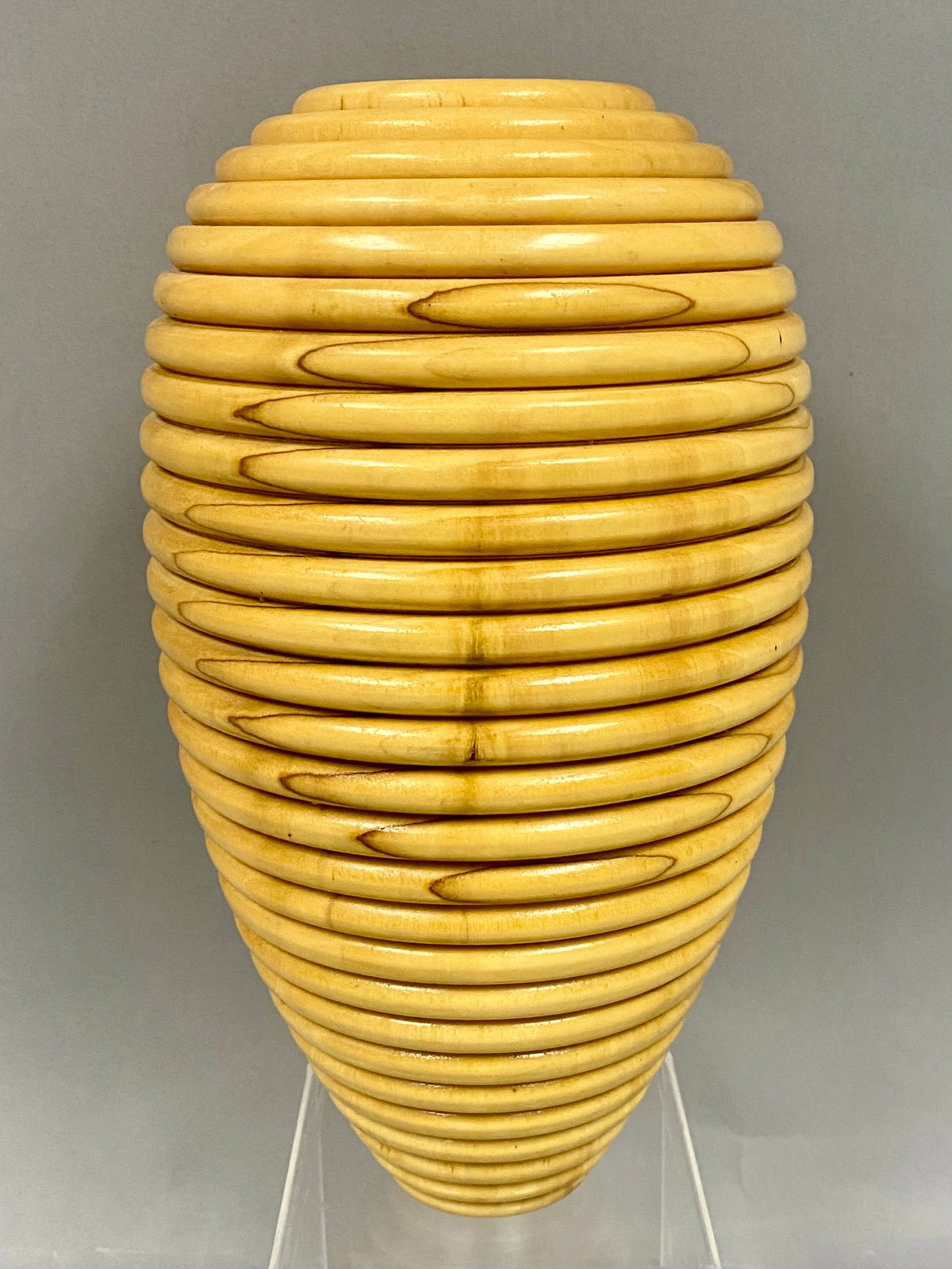 Vintage Bruce Forest Signed Wood Turned Vase: This 11-inch tall hand-crafted wooden sculpture vase features a beautifully turned, ribbed design that highlights the wood's warm, natural grain and smooth finish. Signed by artist Bruce Forest, this 