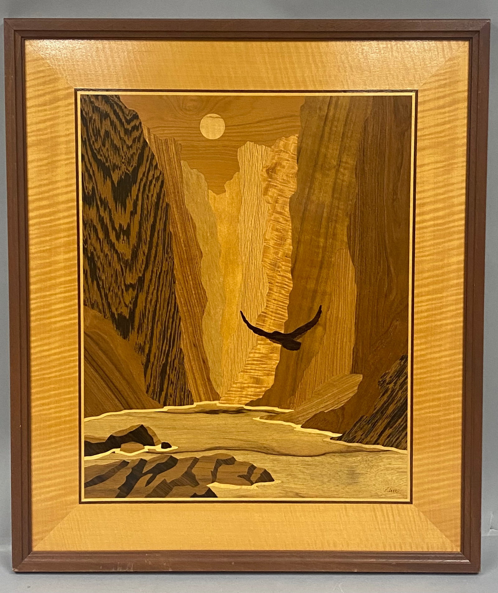 Hudson River Inlay Company, 'The Zion Narrows': This wood marquetry landscape panel, by the Hudson River Inlay company, depicts a soaring bird amidst the towering cliffs of the Zion Narrows. The composition is expertly crafted from a variety of nat