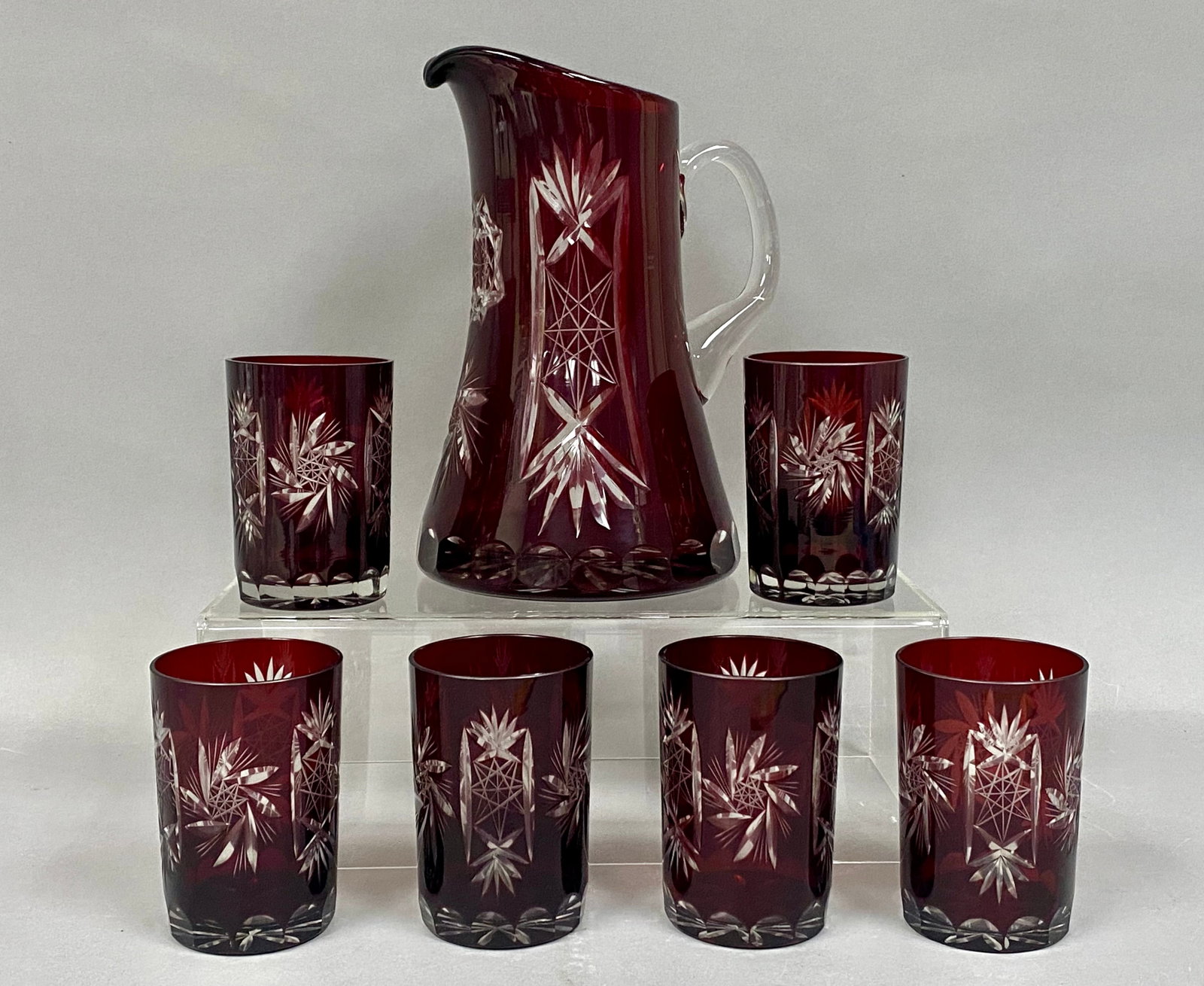 Vintage Bavarian Cut Lead Crystal Lemonade Set: Circa 1960s-70s. This premium set is heavy lead crystal. A deep ruby red crystal overlay layer was fused over a clear crystal base, then deeply hand-carved to slice through the colored layer, leaving
