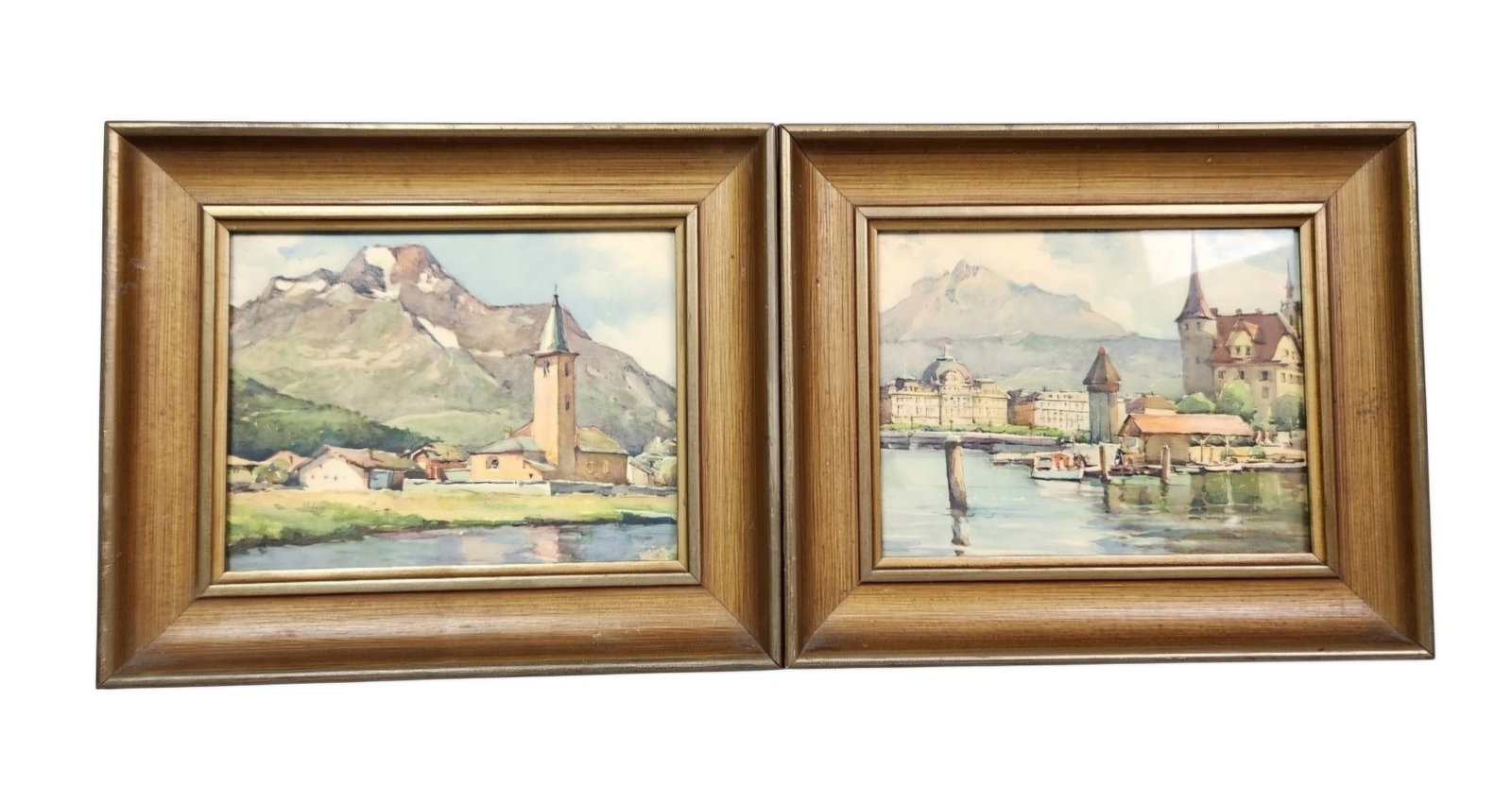 Nicolas Markovitch (A. Marc Swiss Landscape Prints: This pair of framed landscape prints depicts Swiss alpine scenes, titled on the reverse as Village of Engadin and Lake Luzerne and Mt. Pilatus. The works are high-quality mechanical reproductions,
