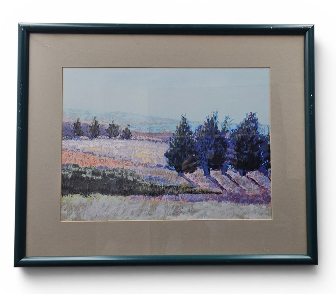 Framed Landscape Print: A framed and matted landscape print depicting a row of trees in blue and purple tones, measuring 25 by 20 inches in its dark teal metal frame. Good condition, see pictures.