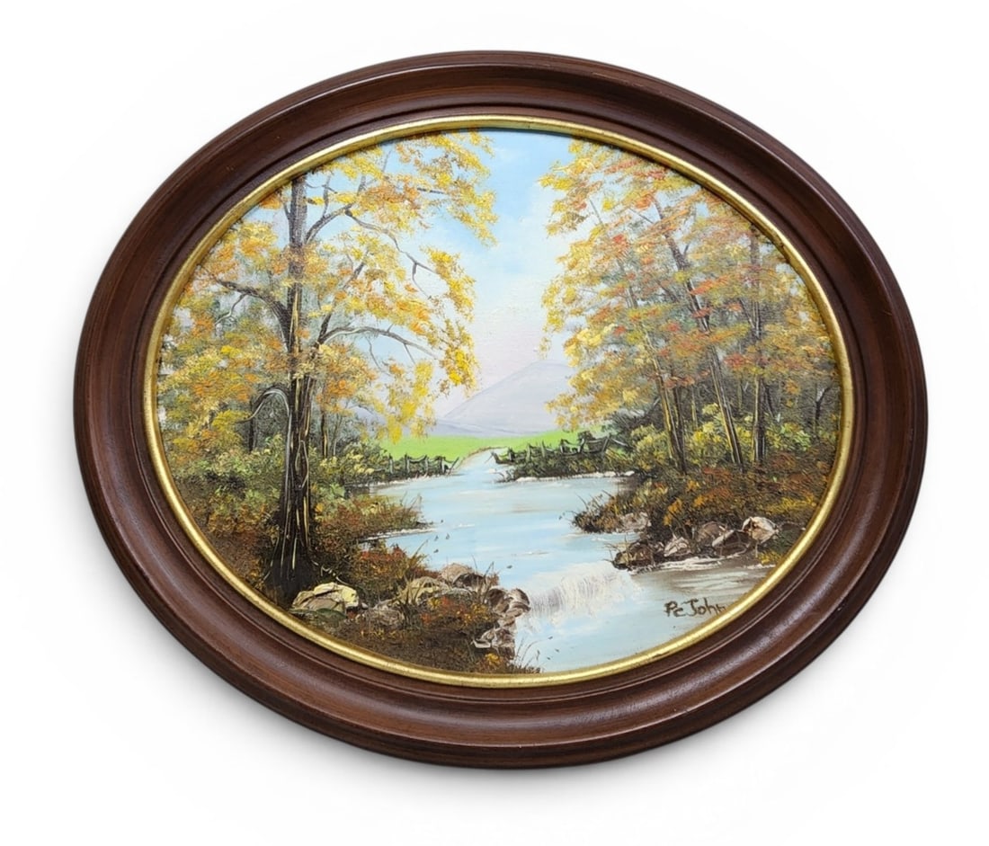 Patricia Carter John Landscape Oil Painting: This oval oil on canvas painting depicts a serene autumnal landscape. The artwork is signed in the lower right corner Pe John. On the reverse, the wooden stretcher bar is hand-inscribed By Patricia