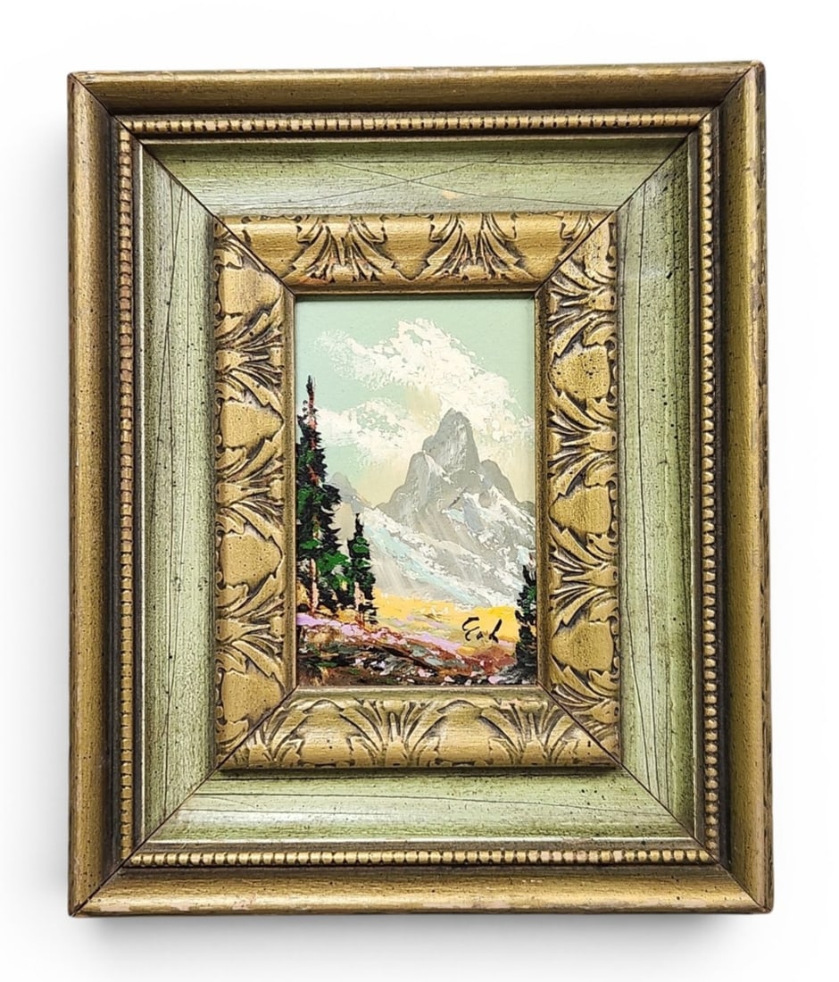 Signed Mountain Landscape Oil on Board: This miniature landscape painting, executed in oil on board, depicts a craggy, snow-capped mountain peak set against a pale green sky with textured clouds. Signature is illegible. 11.5 x 9.5 inches