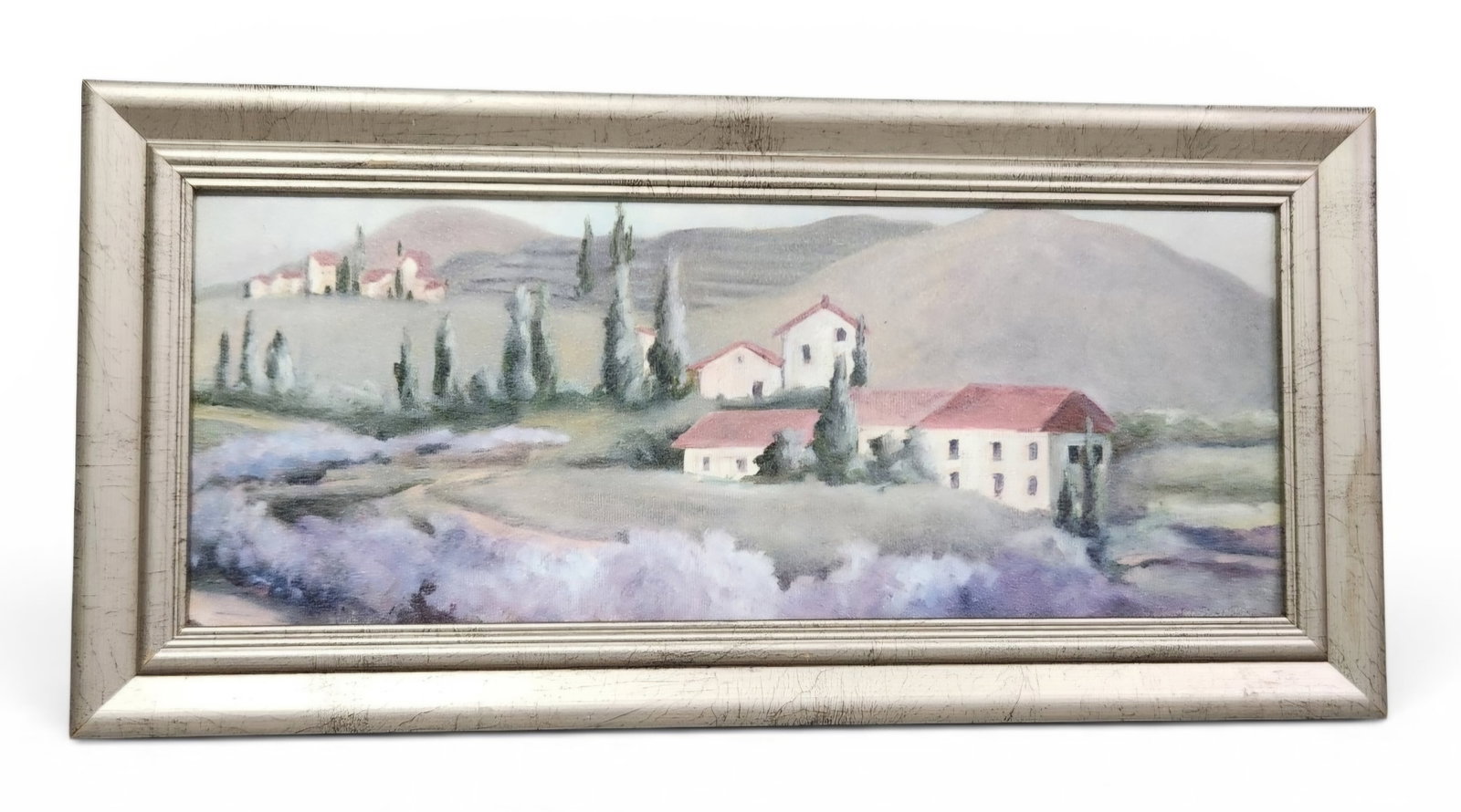 Mediterranean Lavender Field Oil on Canvas: This horizontal landscape painting depicts a Mediterranean-inspired scene with white-walled, red-roofed buildings set among tall cypress trees and rolling hills. The work is signed vertically along th