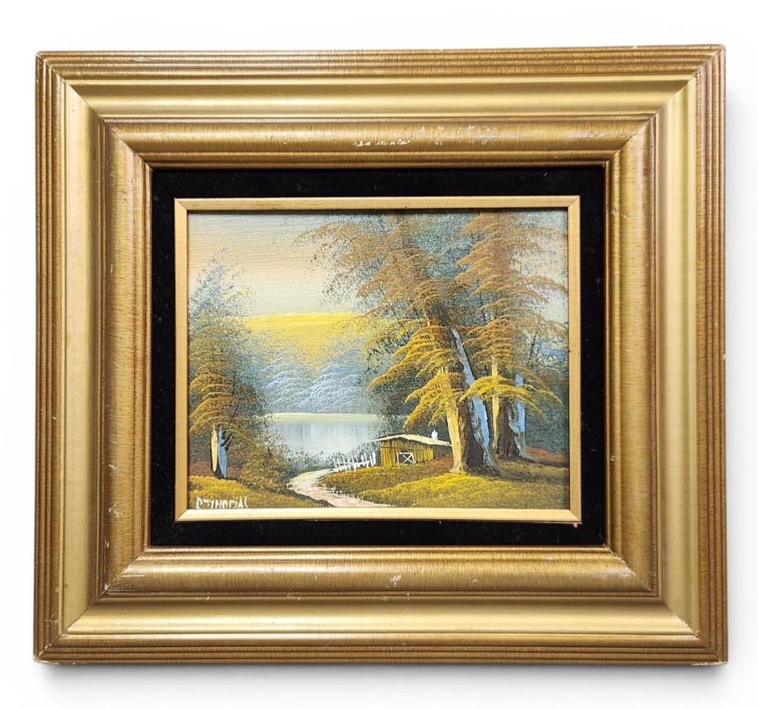 Landscape Oil Painting: A framed landscape oil painting on board depicting a cabin by water. Signature appears to be P. or R. Thomas and measuring 17 by 15 inches including the frame. Good overall condition, see pictures.