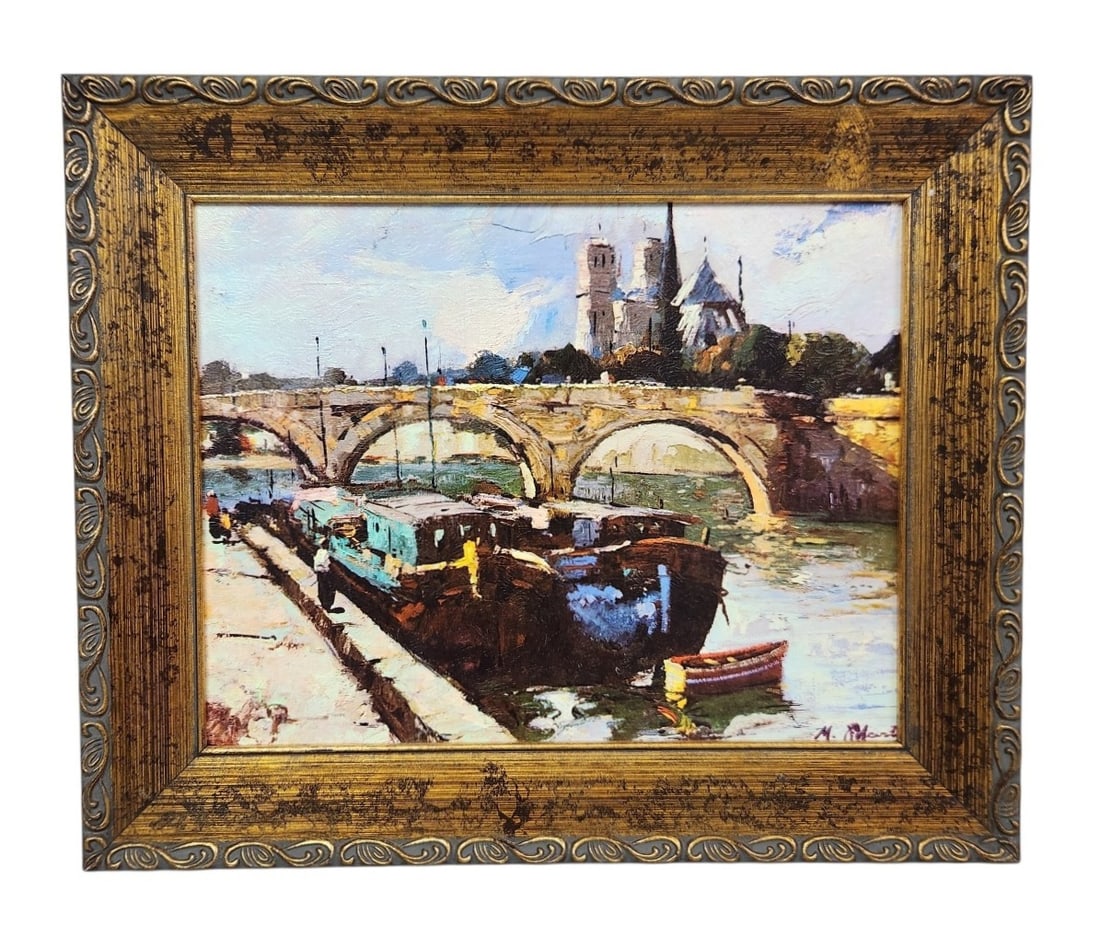 M. Robert Paris Notre-Dame Oil: This modern oil painting on board by M. Robert depicts an iconic view of the Notre-Dame Cathedral with river barges moored along the Seine. 18 x 15 inches. The painting remains in good condition with