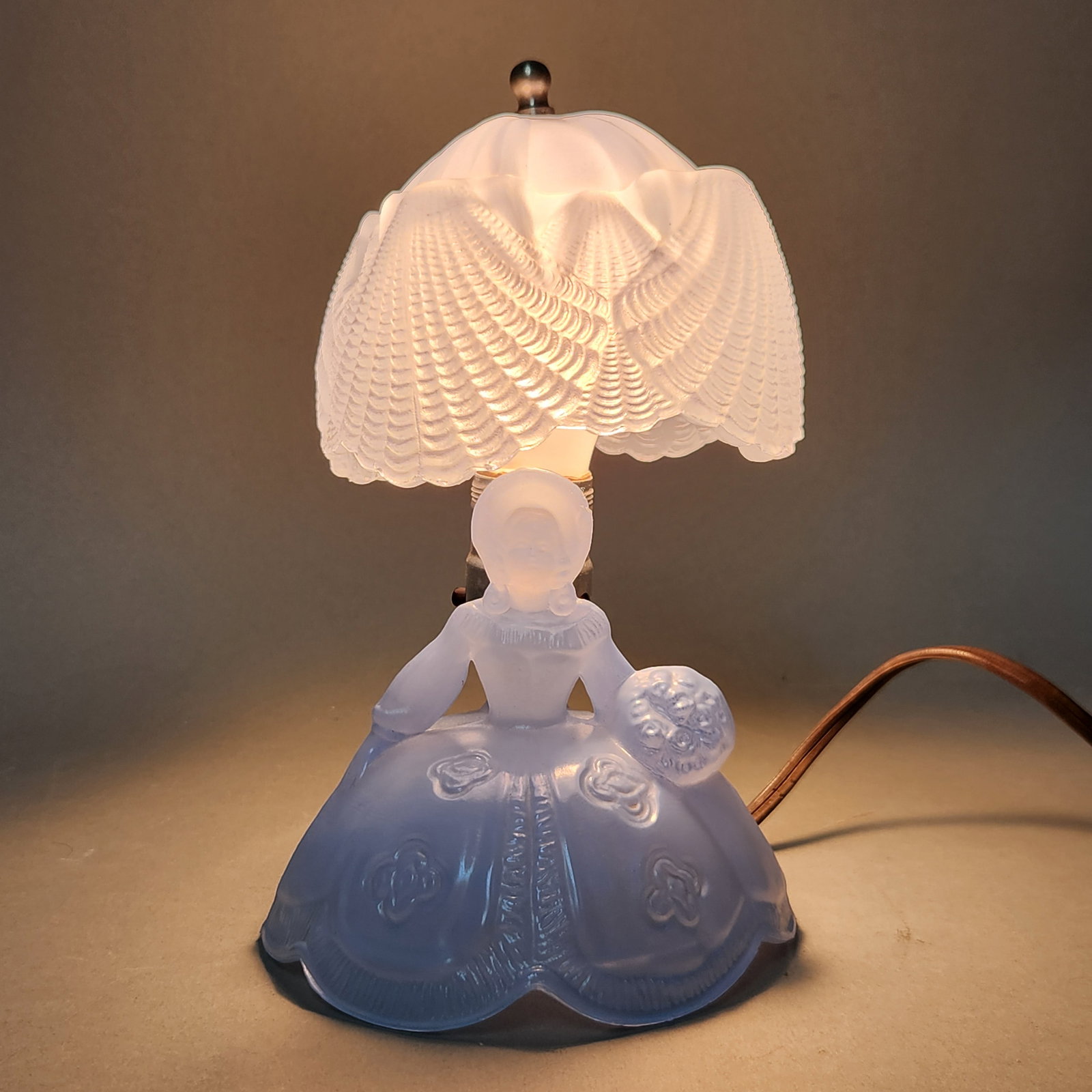 L.E. Smith Southern Belle Boudoir Lamp: This vintage L.E. Smith boudoir lamp is composed of translucent light blue molded glass with a satin finish. Height: 9.75 inches; Shade Width: 6 inches; Base Diameter: 5.5 inches. Good vintage