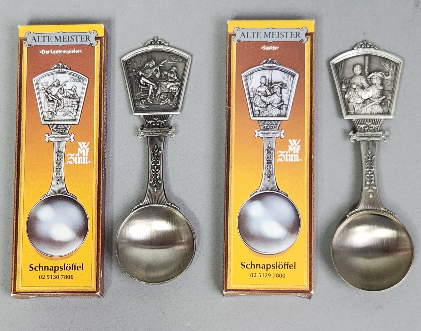 WMF Pewter Schnapps Spoons: This pair of German cast pewter schnapps spoons was produced by WMF as part of the Alte Meister series. The handles feature high-relief cast scenes based on seventeenth-century Dutch paintings,