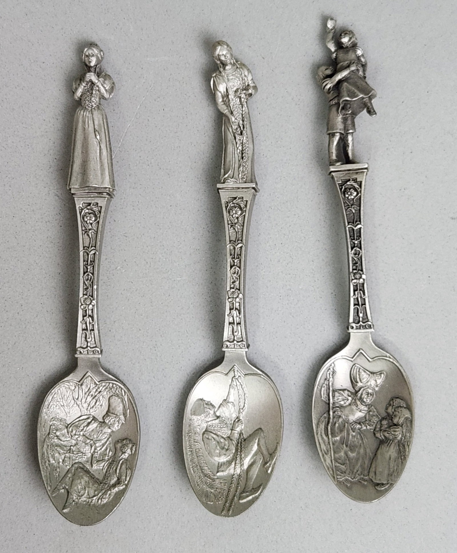 Franklin Mint Fairy Tale Spoons #2: Trio of cast pewter collector spoons produced by the Franklin Mint in 1979. Sleeping Beauty, Rapunzel, or Hansel and Gretel. Length: 5.75 to 6 inches each. Good vintage condition with light surface