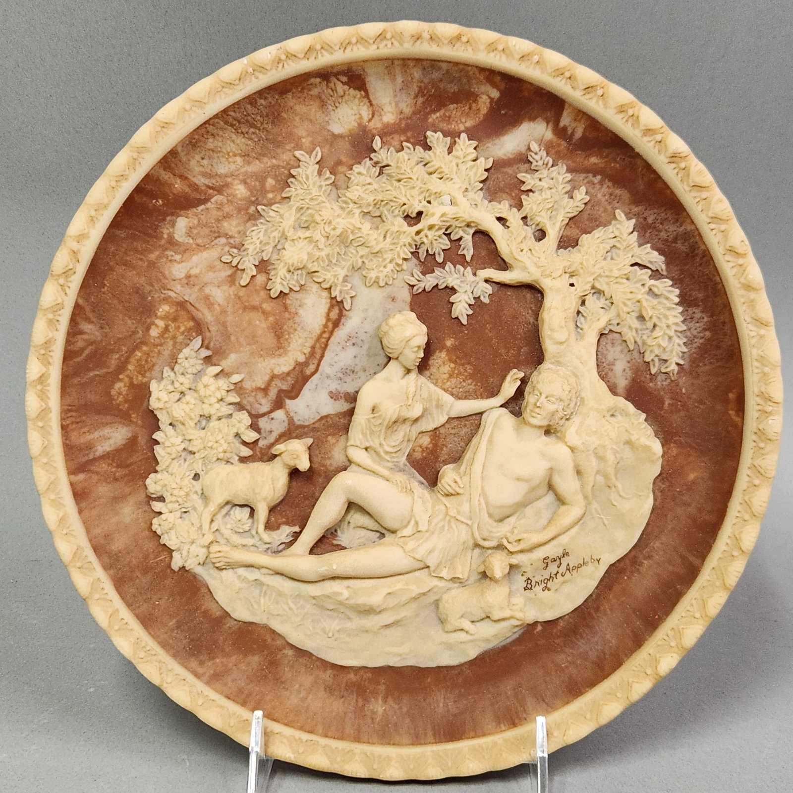 Incolay Stone Romantic Poets Plate: An Incolay stone cameo collector plate titled A Thing of Beauty from the Romantic Poets series. Sculptured by Gayle Bright Appleby for Incolay Studios, 1978. The plate is in excellent condition with