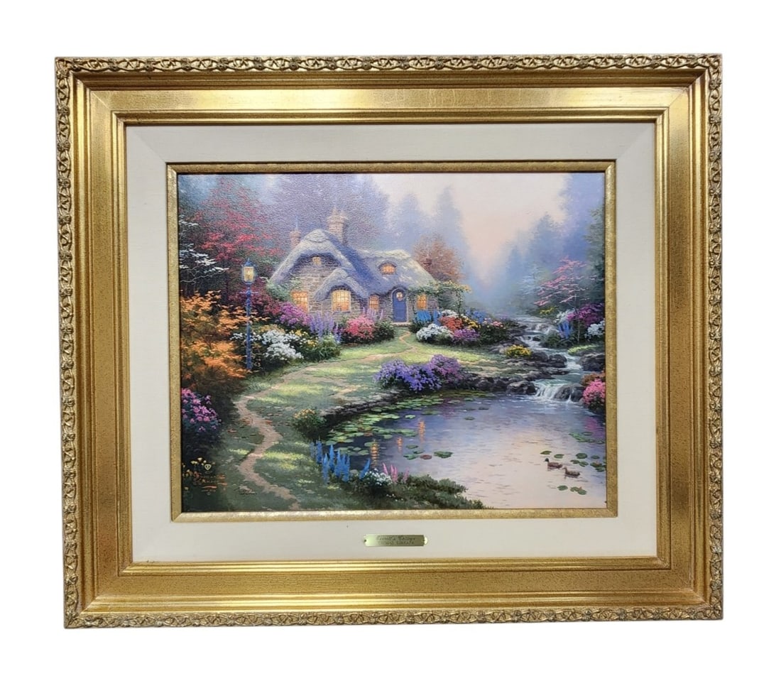 Thomas Kinkade Everett's Cottage Lithograph: 1998 limited edition canvas lithograph by Thomas Kinkade titled Everett's Cottage, numbered 145/2100 as an International Proof. Exterior Frame: 29 x 25 inches. Overall very good condition with no visi