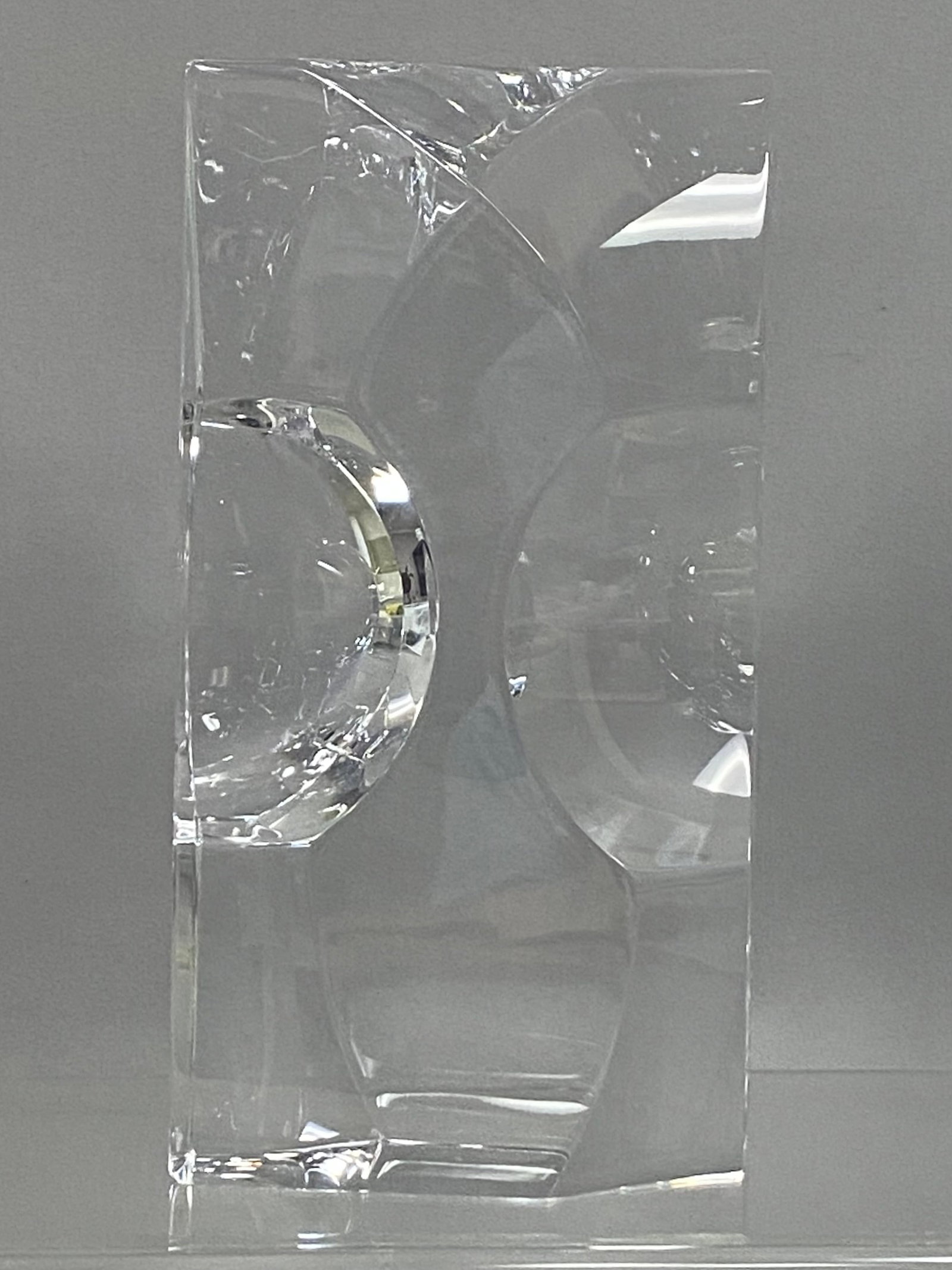 Orrefors Sven Palmquist Crystal Sculpture: A substantial rectangular block of solid clear lead crystal from the Orrefors Gallery series designed by Sven Palmquist. The sculpture features deeply sculpted concave hemispherical lenses and