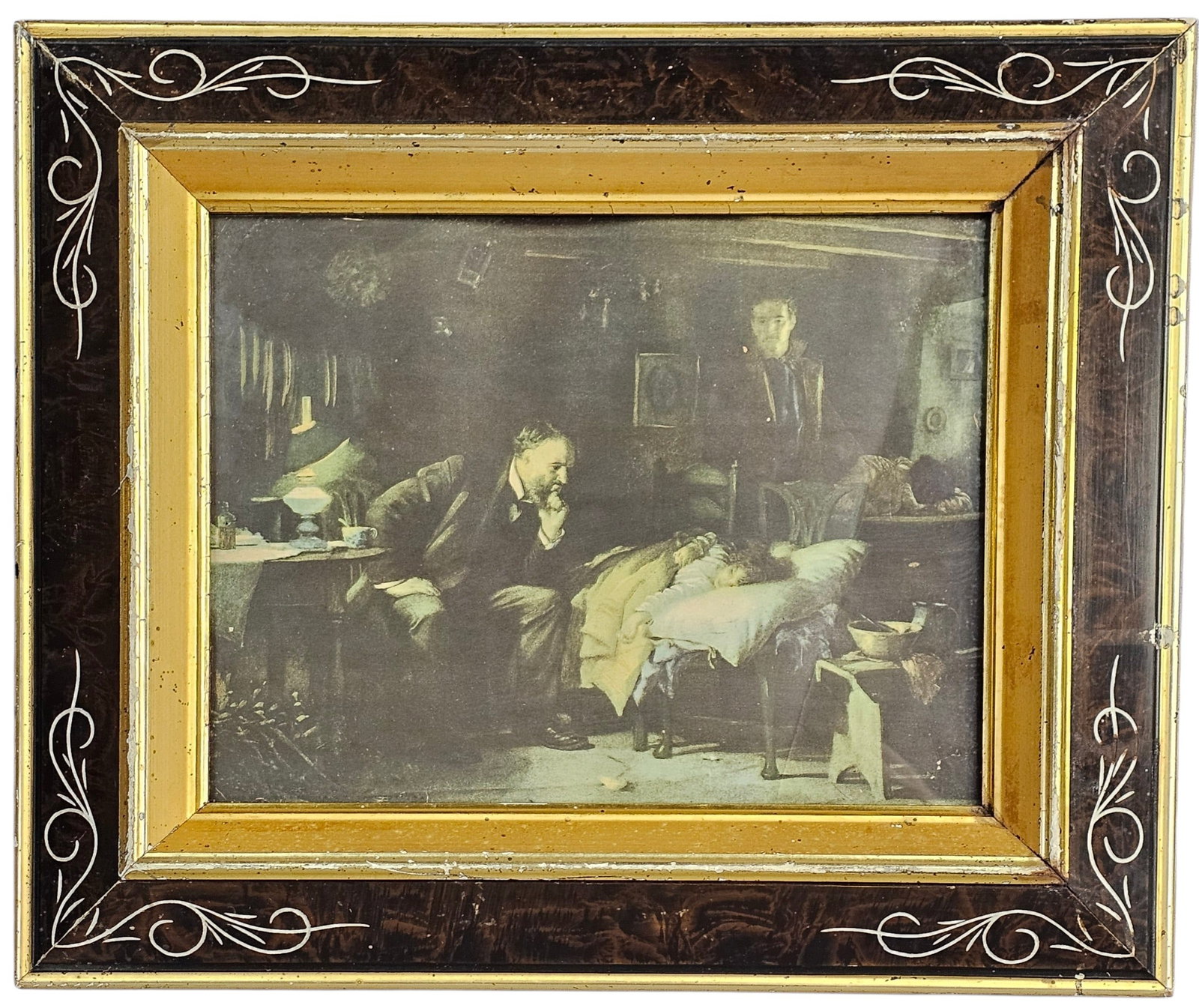 Luke Fildes The Doctor Framed Print: A reproduction print of Sir Luke Fildes 1891 painting titled The Doctor, depicting a physician intently observing a sick child in a rustic cottage interior. The work is presented in a decorative