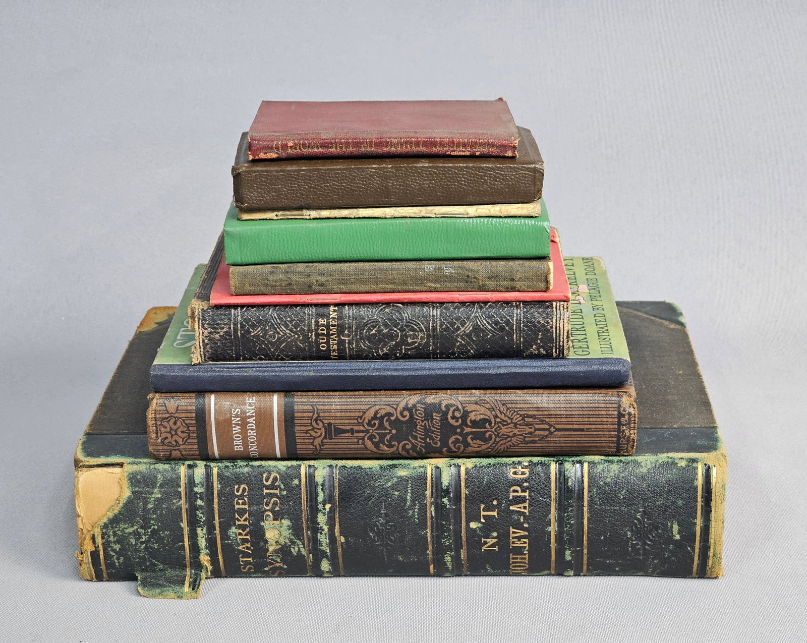 Assortment of Vintage and Antique Devotional Volumes: An assortment of 19th and 20th-century religious texts in English, Swedish, and Dutch, featuring Christofer Starke's 1874 New Testament synopsis (Volume 3) and an 1881 Dutch Old Testament. Additional