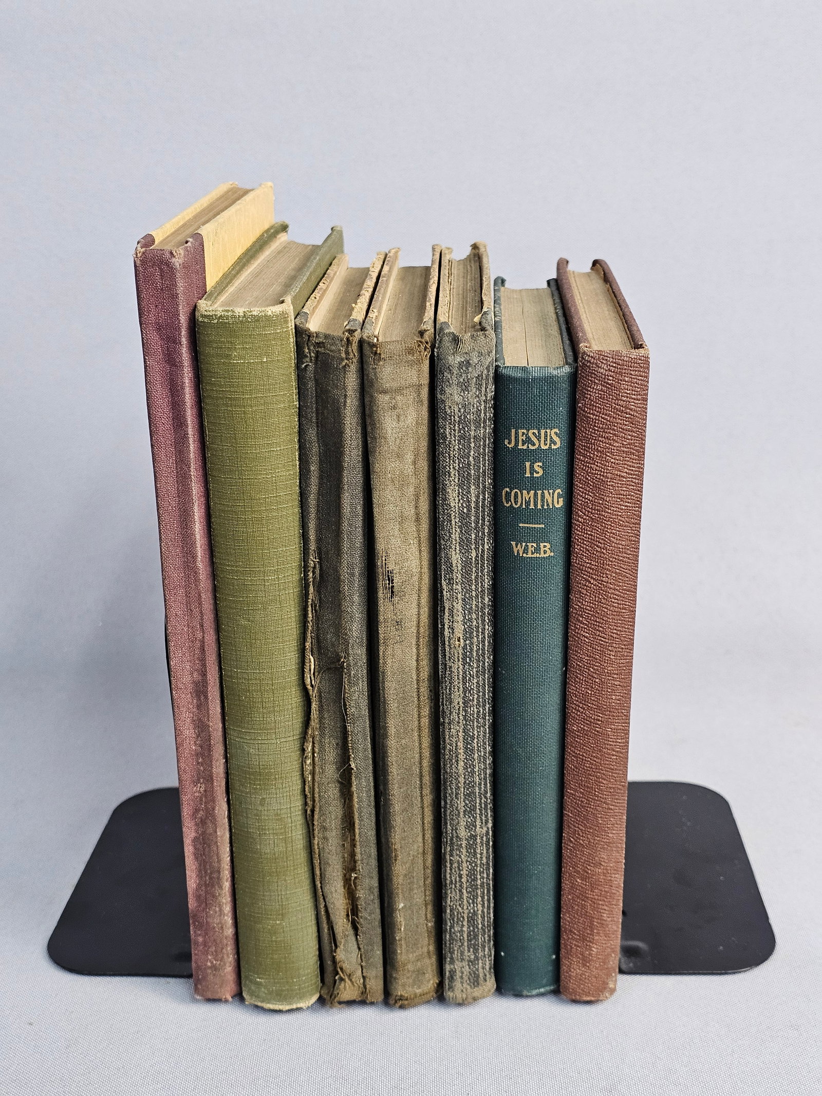 A Collection of Seven Vintage Hymnals: This collection of seven religious volumes includes titles such as Alleluia (1916), Jesus is Coming (1908), and Gospel Hymns No. 5 (1890). Several copies bear the ownership inscriptions of Mrs. John