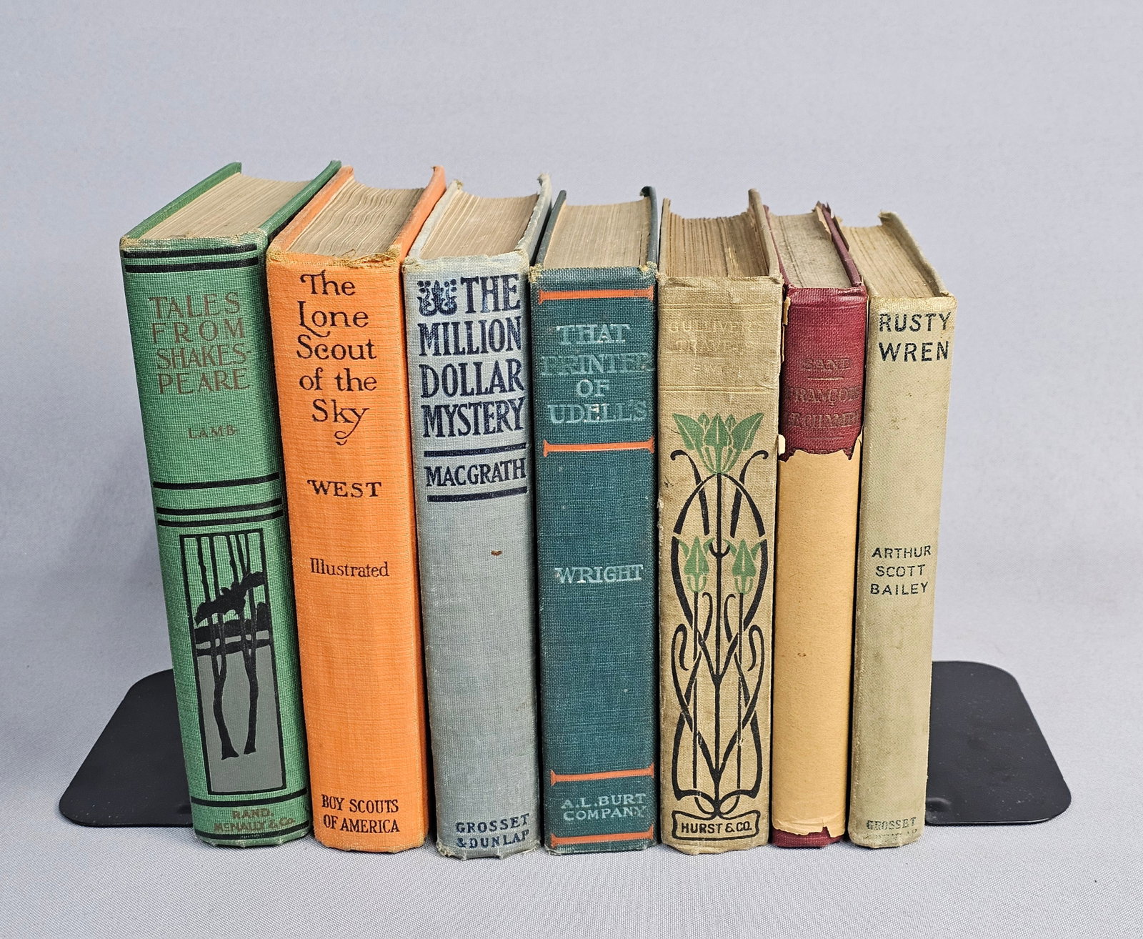 Collection of Vintage Early Twentieth Century Books: This assortment features early 20th century volumes comprising literary classics, juvenile fiction, and historical accounts from various publishers. The group includes a 1928 Boy Scouts of America edi